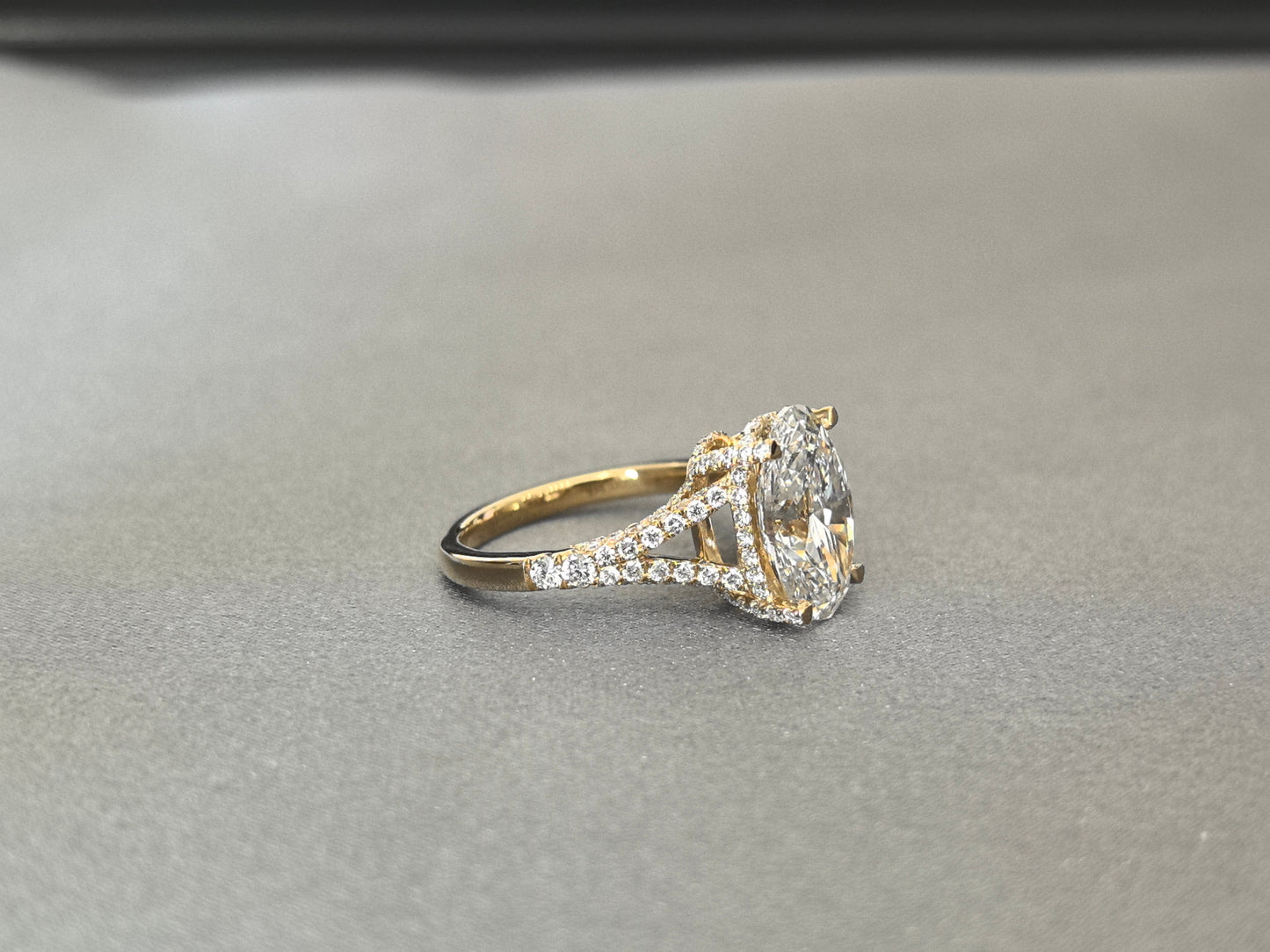Oval Cut Four-Prong Solitaire - Pave Set Diamond Shank - Hidden Halo & Half Pavé Band
