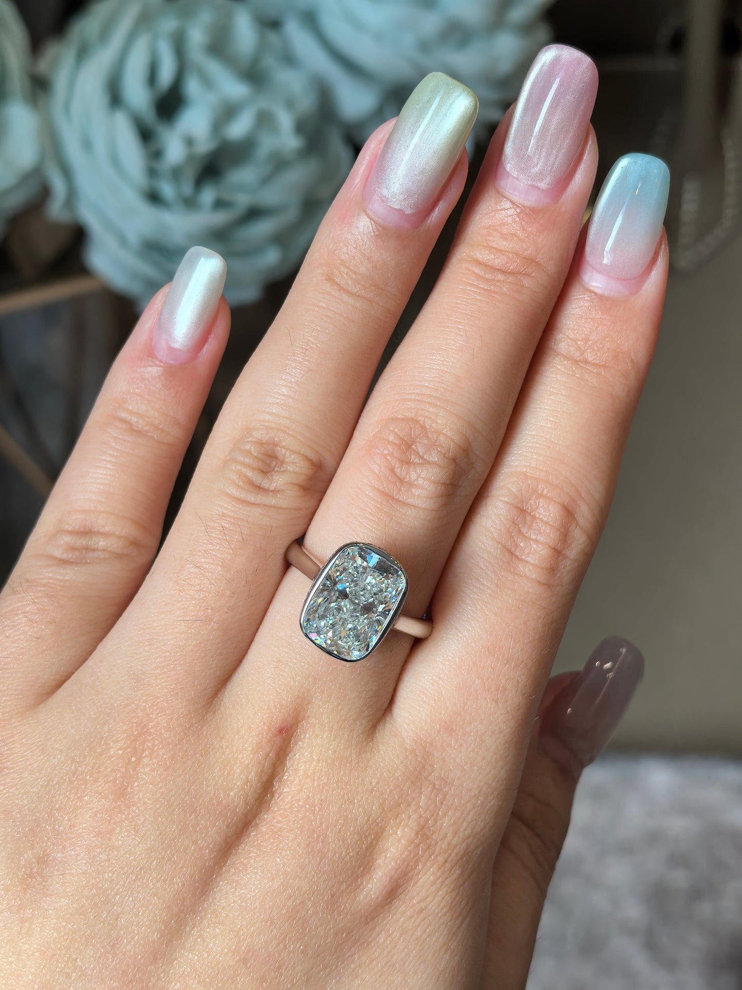 Long Cushion Cut Diamond Ring with a Pink Surprise
