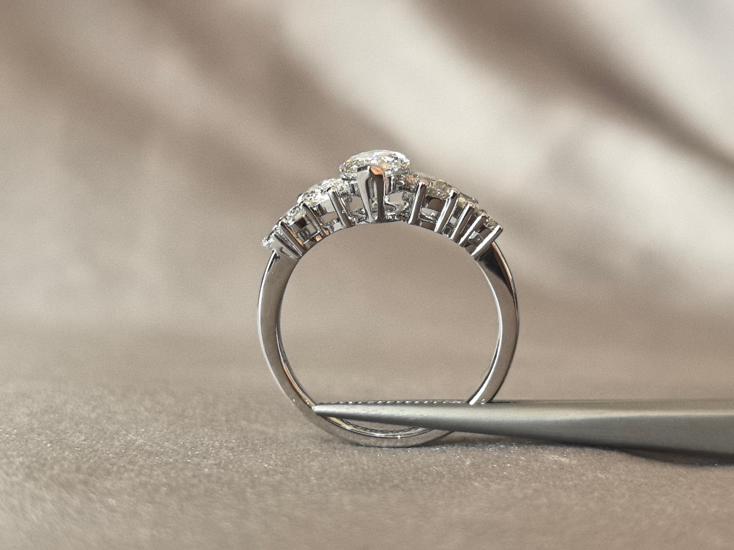 Marquise-shaped lab diamond ring - Upside-down teardrop design on both sides - Pear-shaped side stones