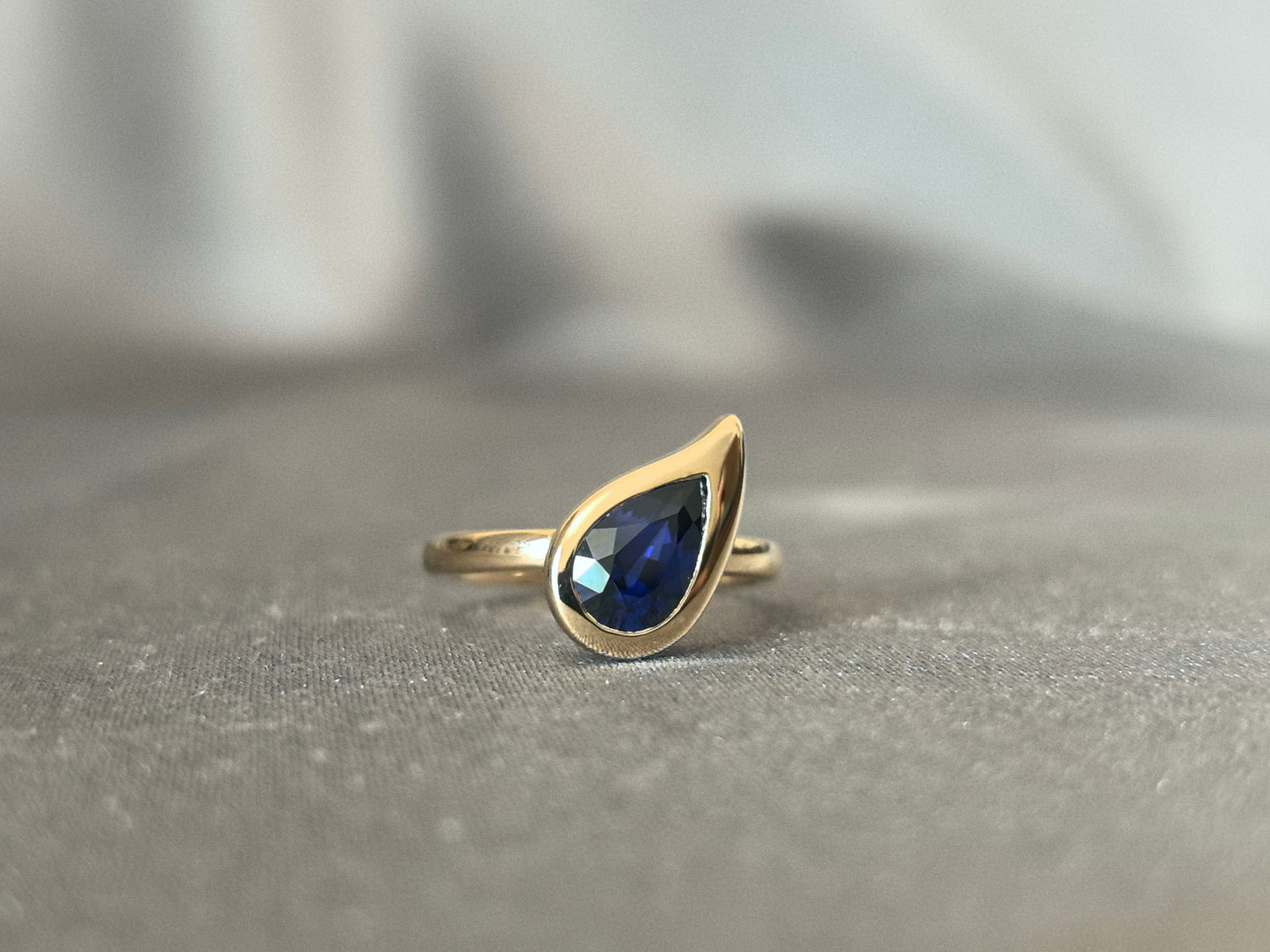 Pear-shaped Lab-Grown Diamond Pinky Ring - Blue Gemstone - Full Halo Setting