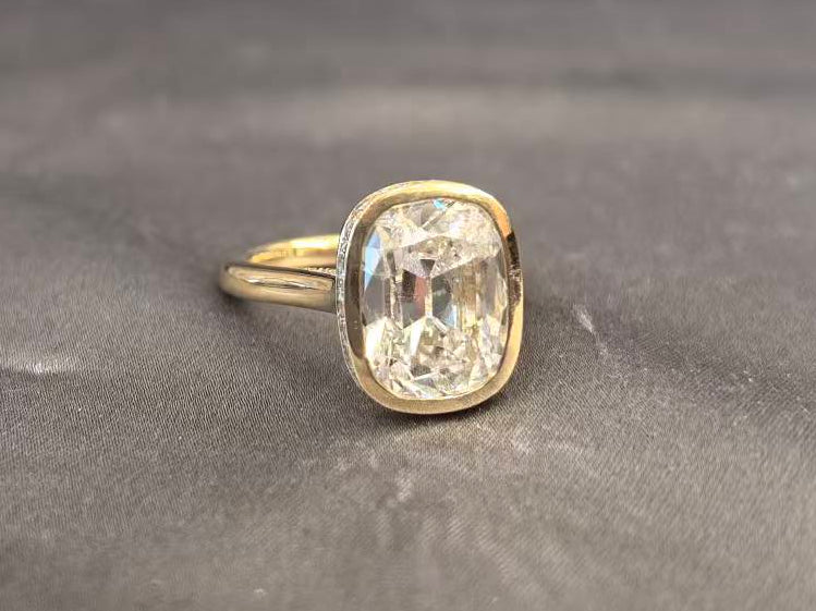 7-carat old mine cut elongated cushion bezel setting In 14K yellow gold