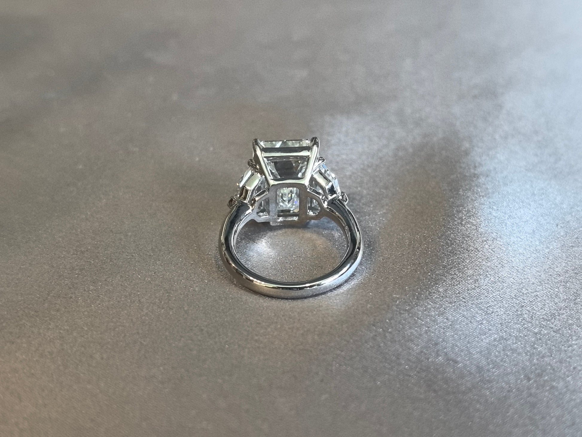 Emerald-Center Trilogy Ring with Cadillac Sidestones