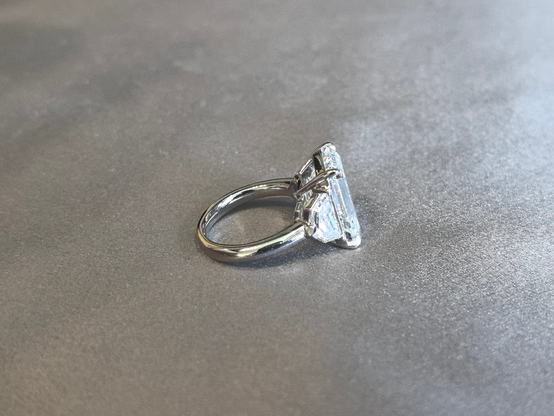 Emerald-Center Trilogy Ring with Cadillac Sidestones