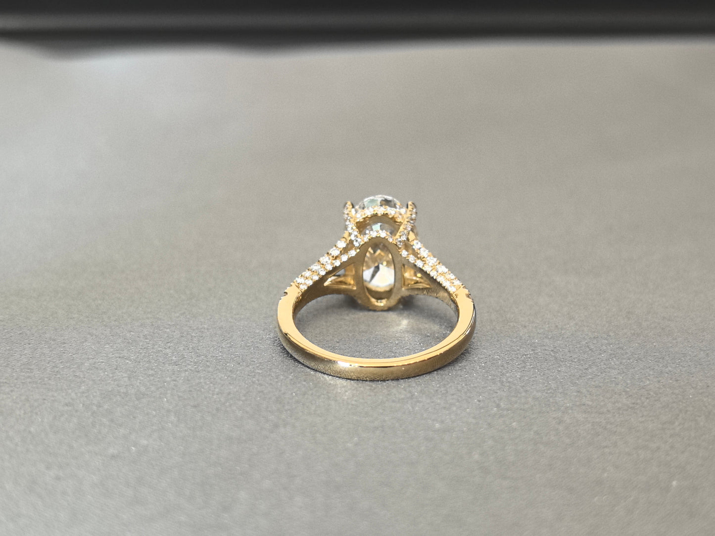 Oval Cut Four-Prong Solitaire - Pave Set Diamond Shank - Hidden Halo & Half Pavé Band