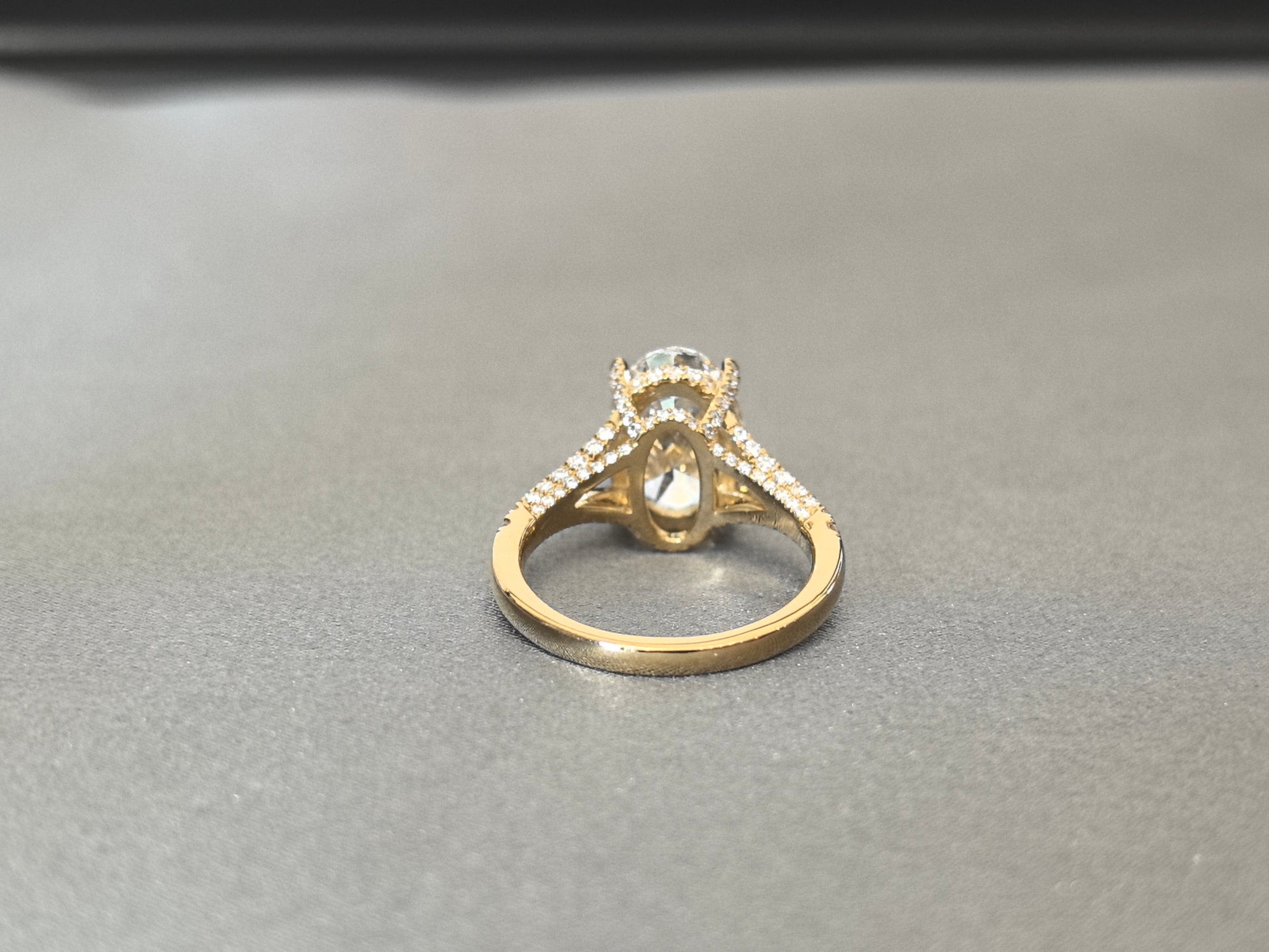 Oval Cut Four-Prong Solitaire - Pave Set Diamond Shank - Hidden Halo & Half Pavé Band