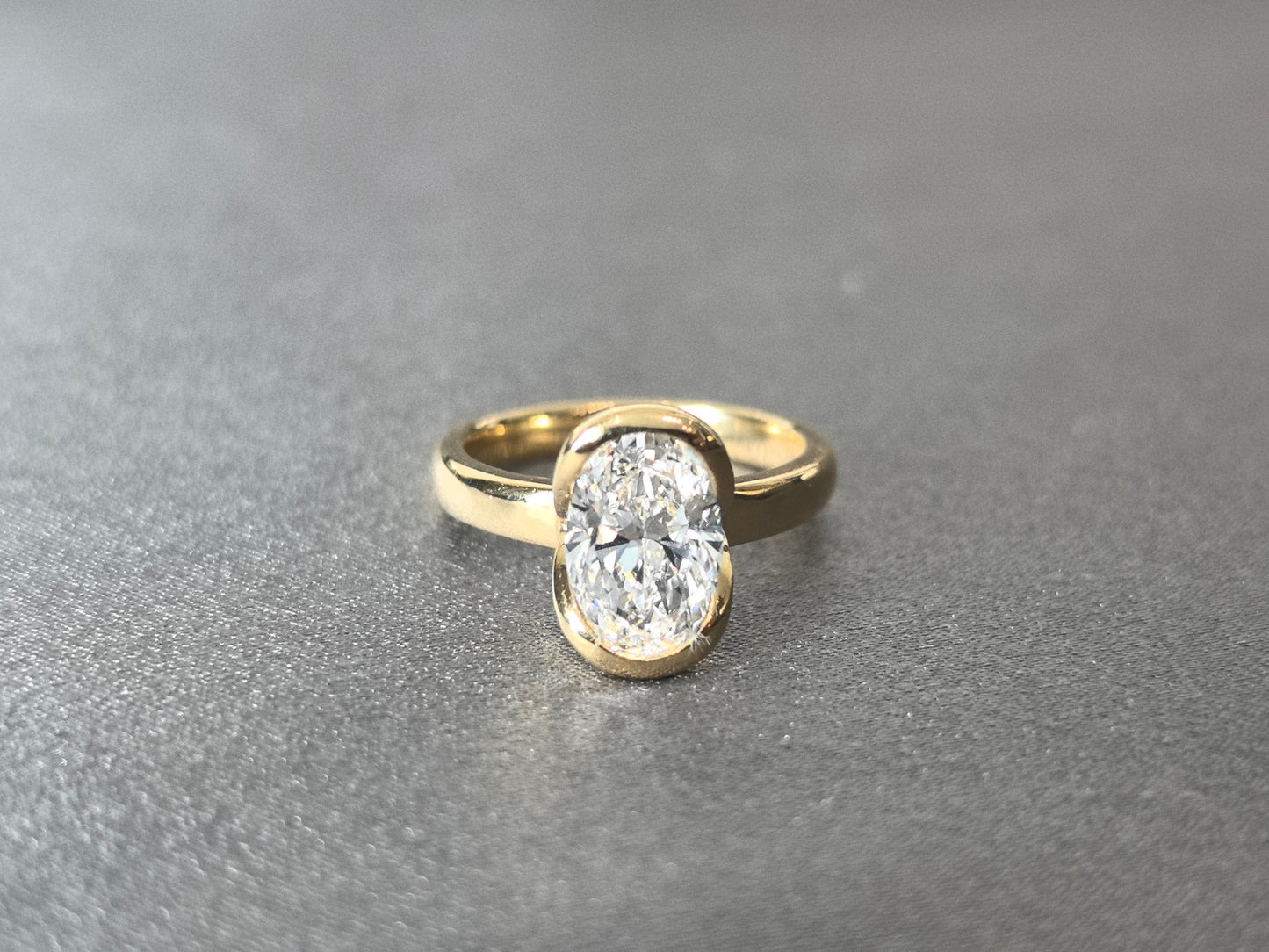 Oval Cut Bezel-Set Solitaire Ring - Wrap-Around Band - Full Bezel Protection Design