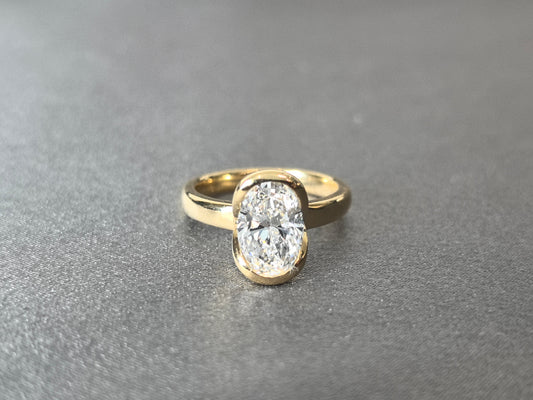 Oval Cut Bezel-Set Solitaire Ring - Wrap-Around Band - Full Bezel Protection Design