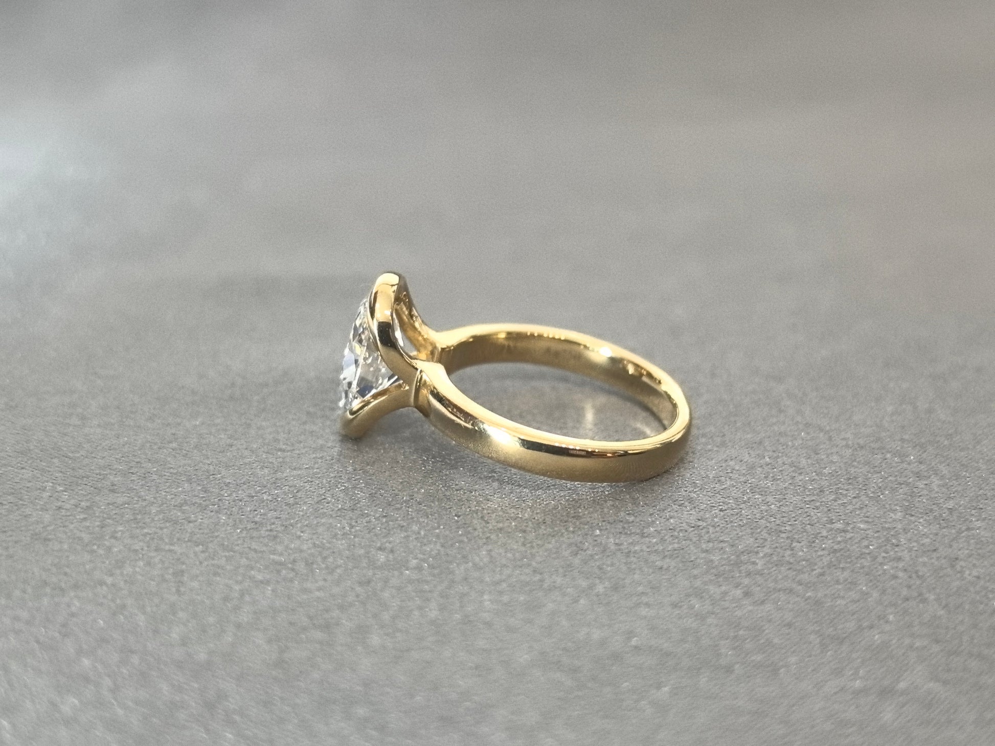 Oval Cut Bezel-Set Solitaire Ring - Wrap-Around Band - Full Bezel Protection Design