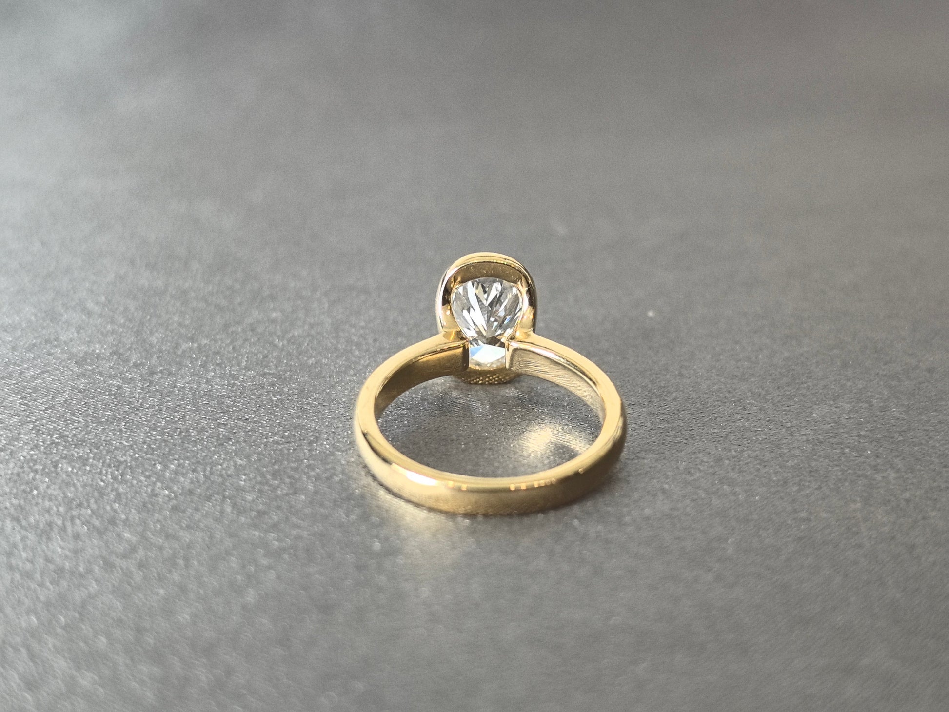 Oval Cut Bezel-Set Solitaire Ring - Wrap-Around Band - Full Bezel Protection Design