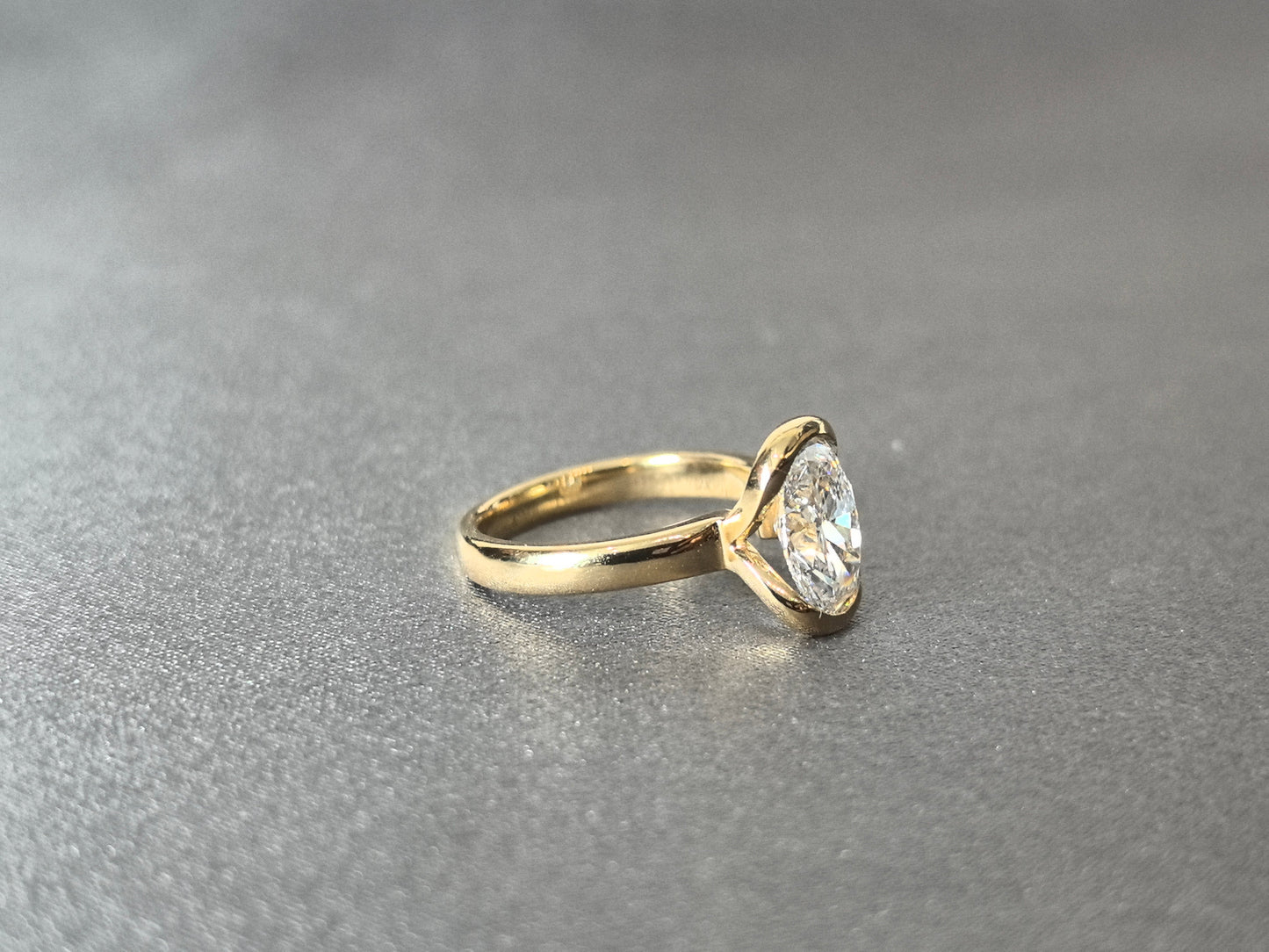 Oval Cut Bezel-Set Solitaire Ring - Wrap-Around Band - Full Bezel Protection Design