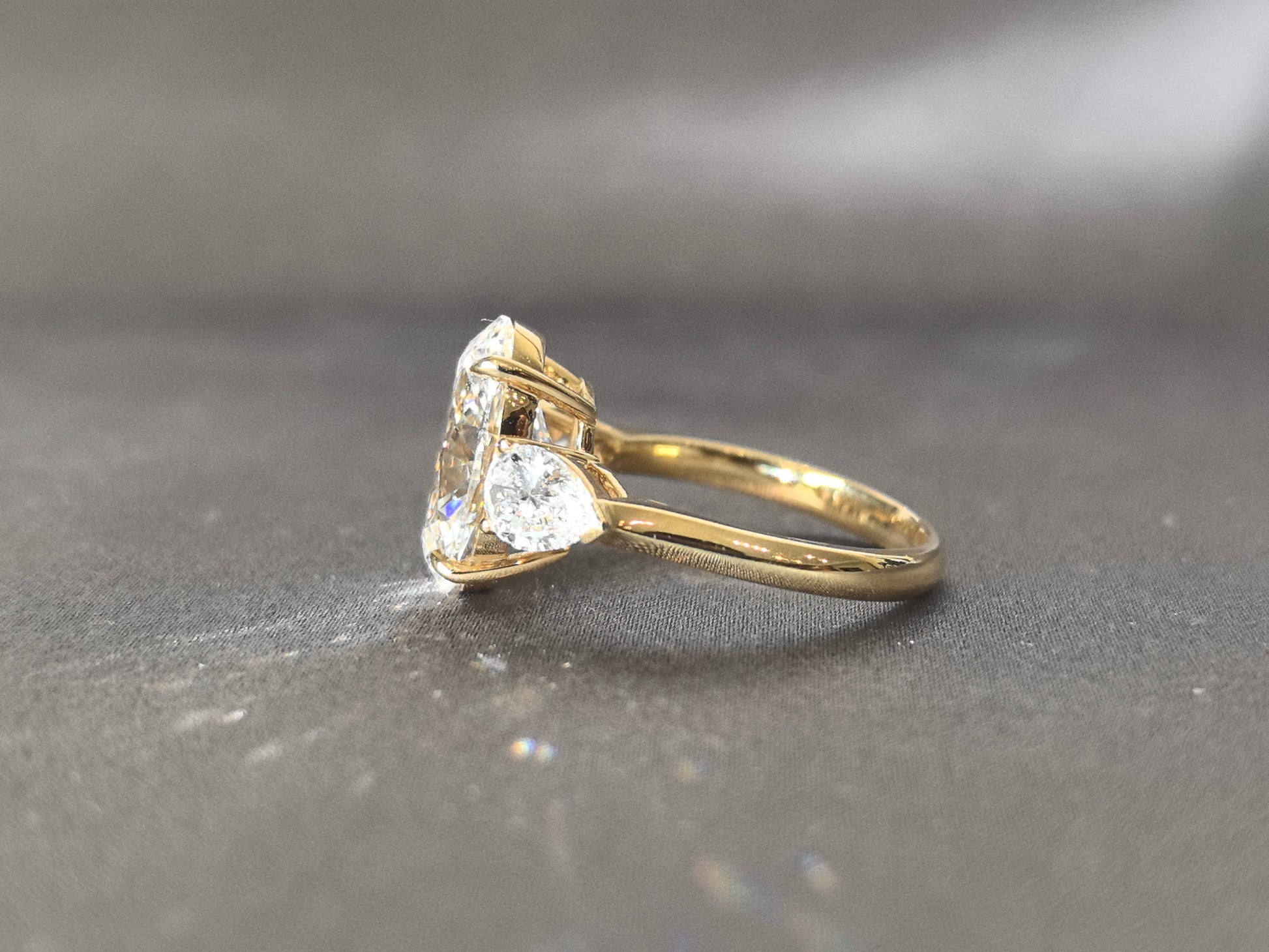 Oval Center Trilogy Ring - Pear Sidestones - Fluid Elegance