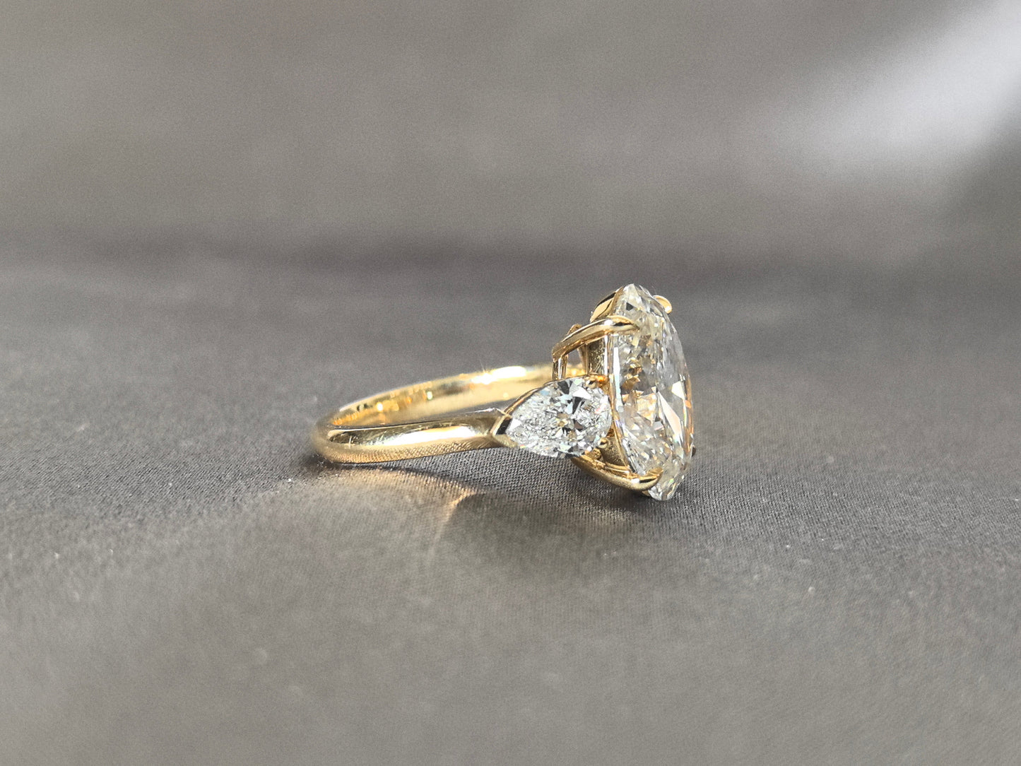 Oval Center Trilogy Ring - Pear Sidestones - Fluid Elegance
