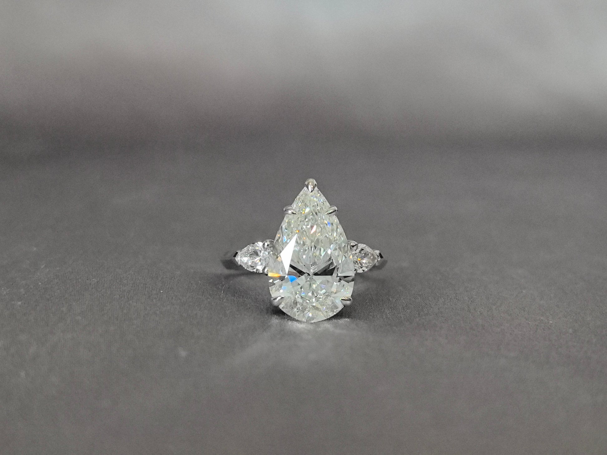 Pear-Center Trilogy Ring - Pear Sidestones - Fluid Harmony