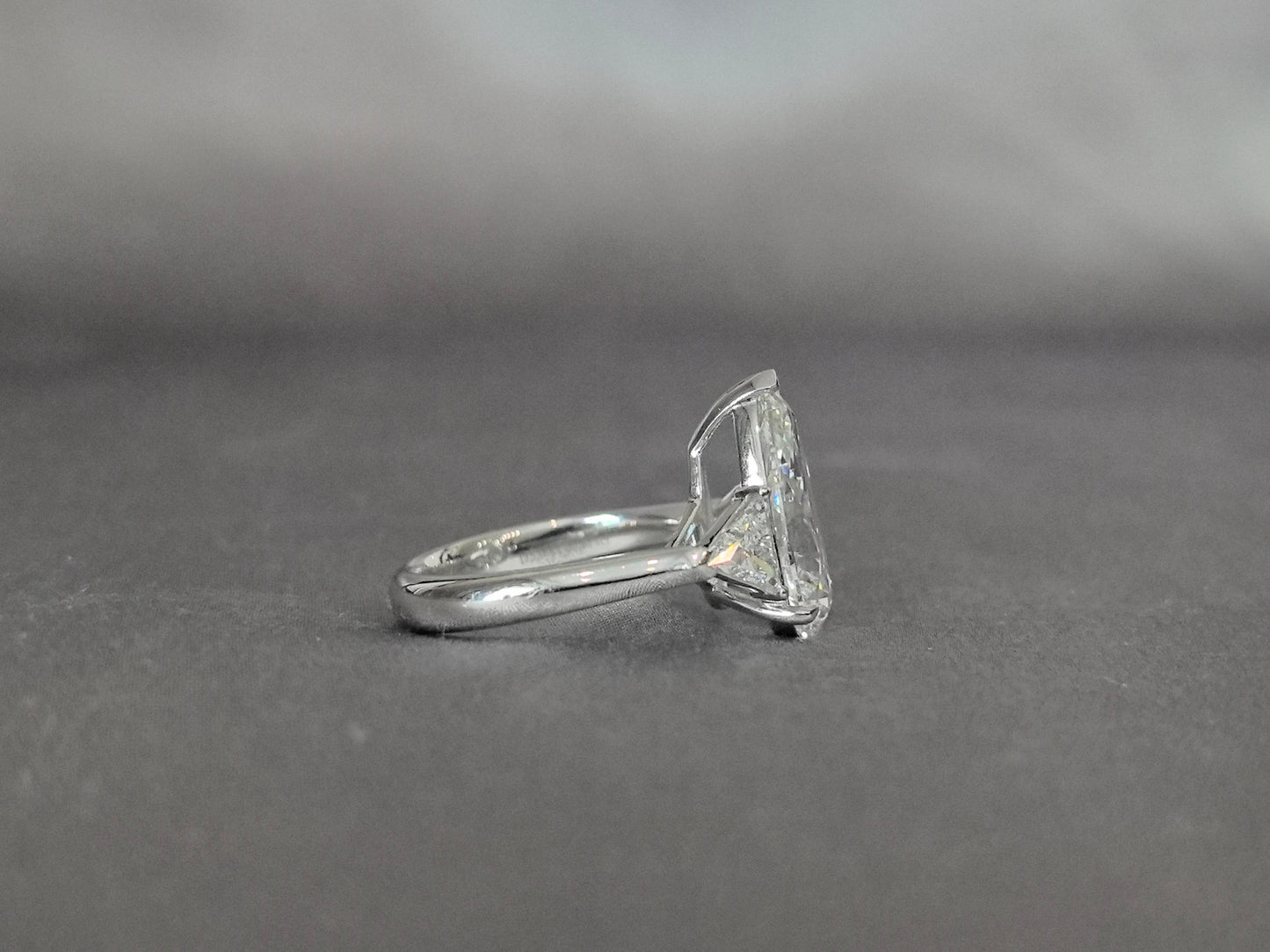 Pear-Center Trilogy Ring - Trillion-Cut Sidestones - Fluid Geometry