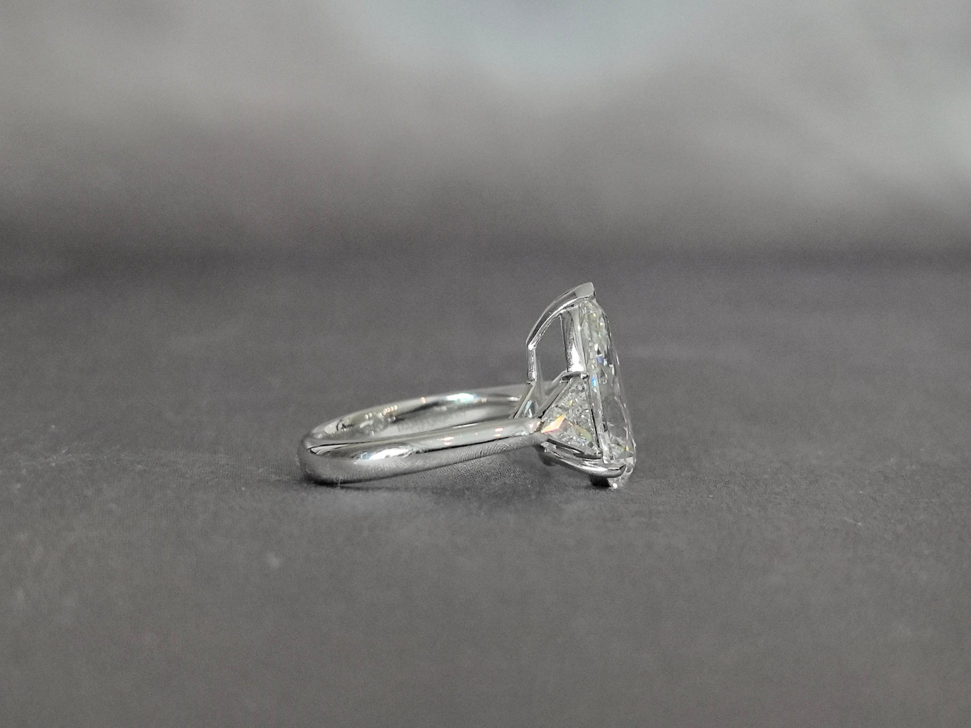 Pear-Center Trilogy Ring - Trillion-Cut Sidestones - Fluid Geometry