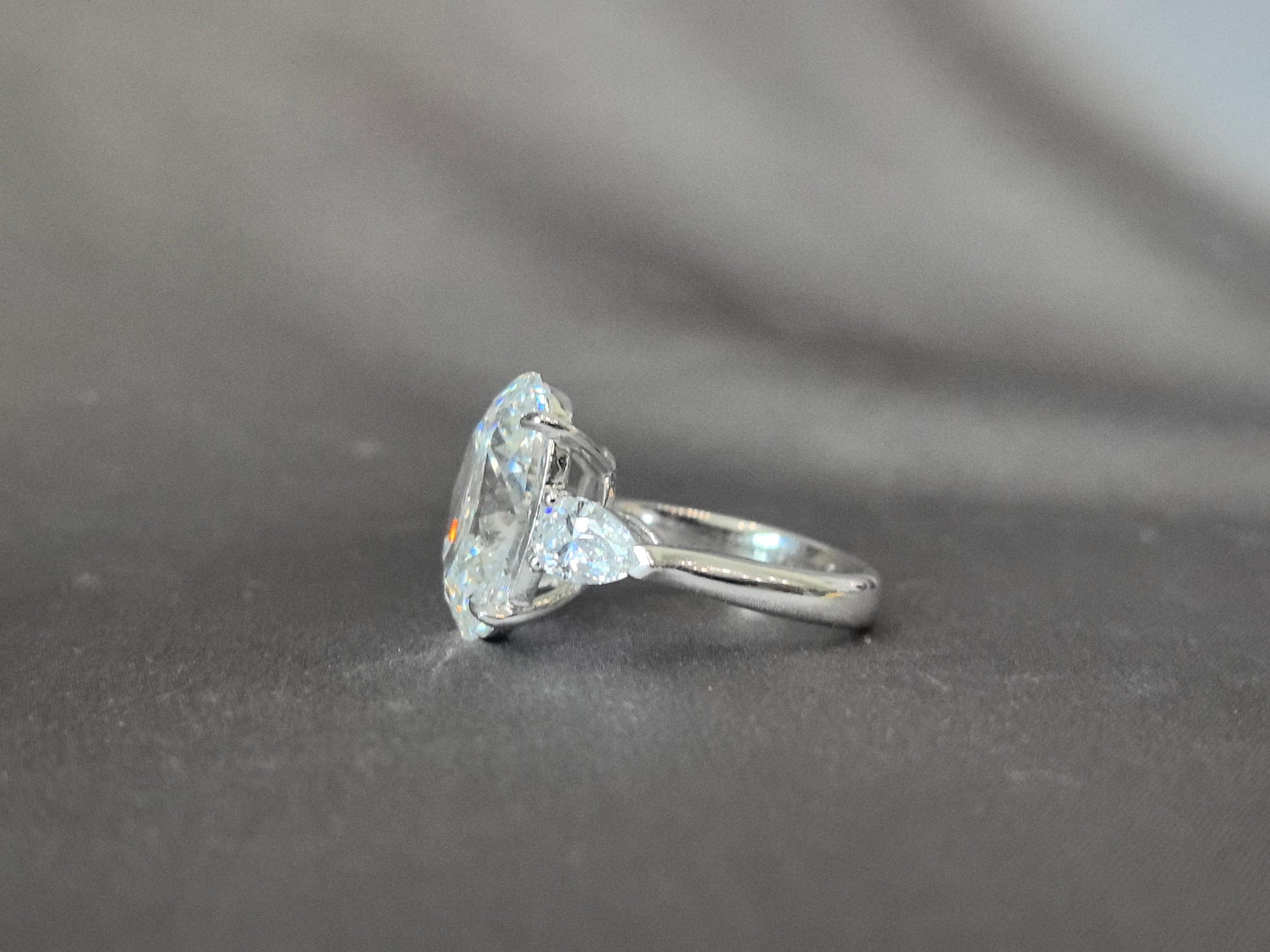 Oval-Center Trilogy Ring - Pear Sidestones - Classic Timeless