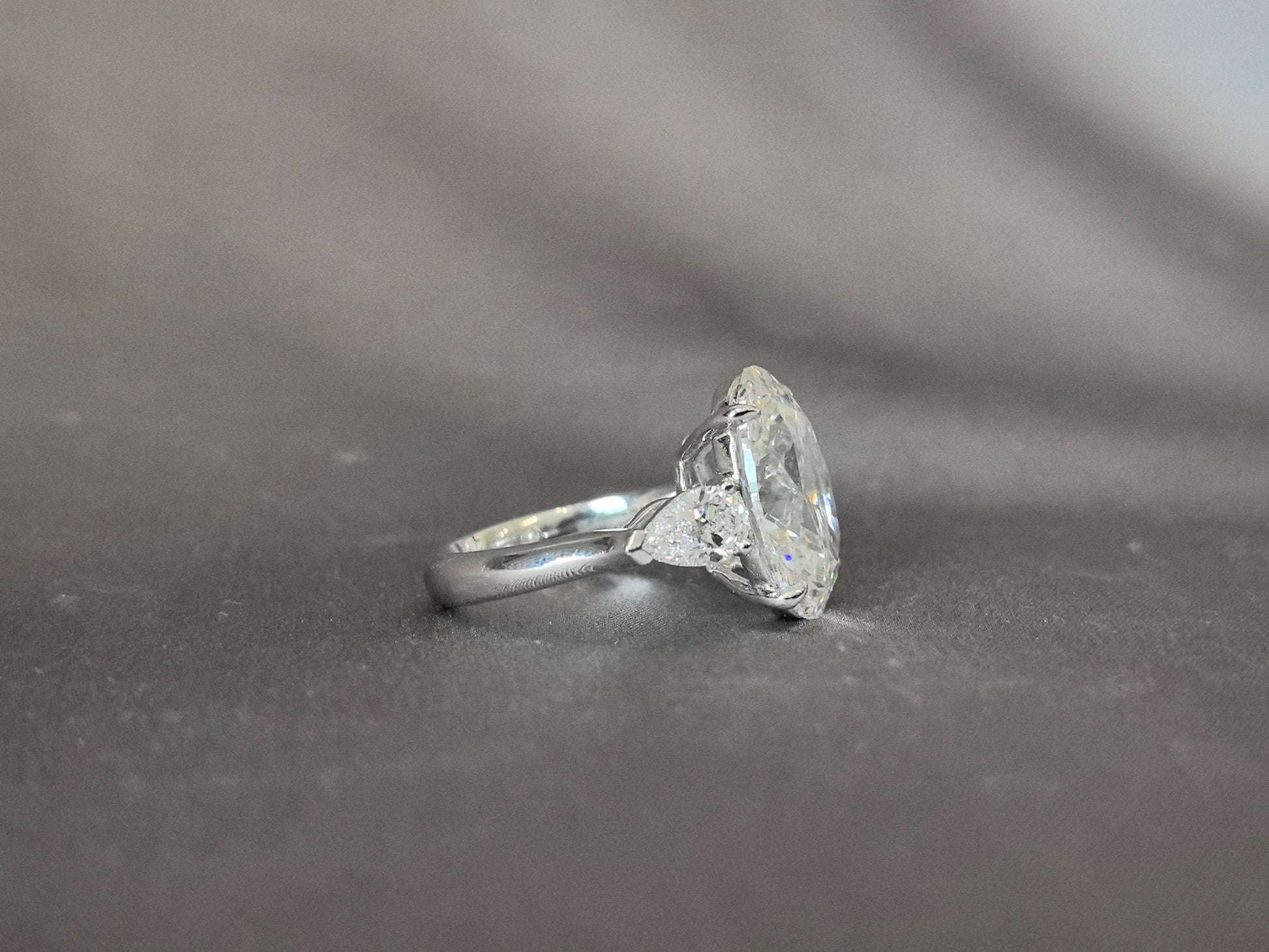 Oval-Center Trilogy Ring - Pear Sidestones - Classic Timeless