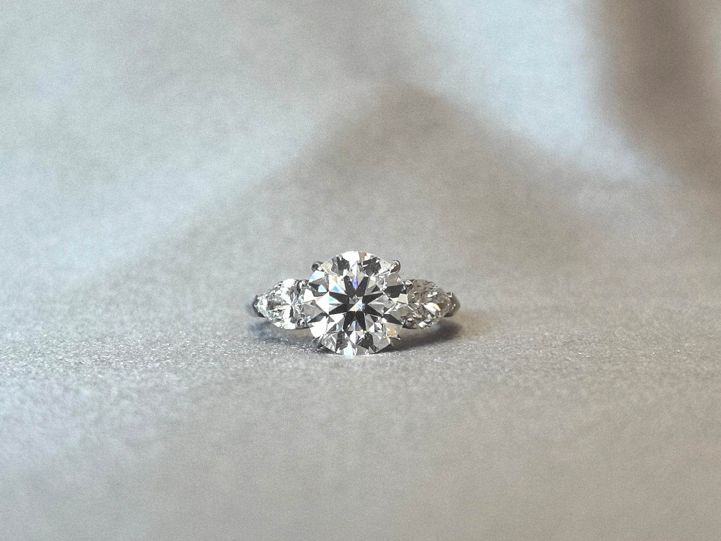 Round-Center Trilogy Ring - Pear Sidestones - Timeless Classic