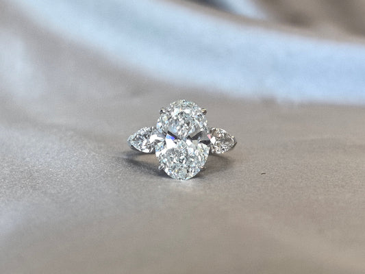 Oval-Center Trilogy Ring - Pear Sidestones - Classic Timeless