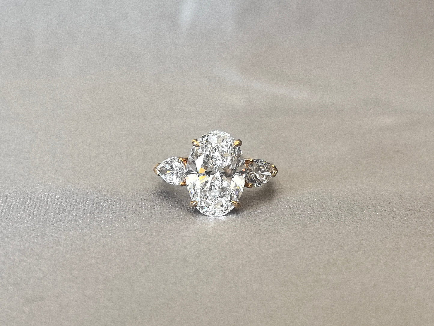 Oval Center Trilogy Ring - Pear Sidestones - Fluid Elegance