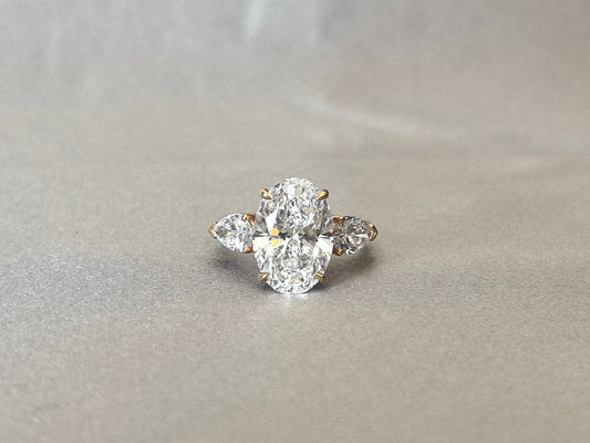Oval Center Trilogy Ring - Pear Sidestones - Fluid Elegance