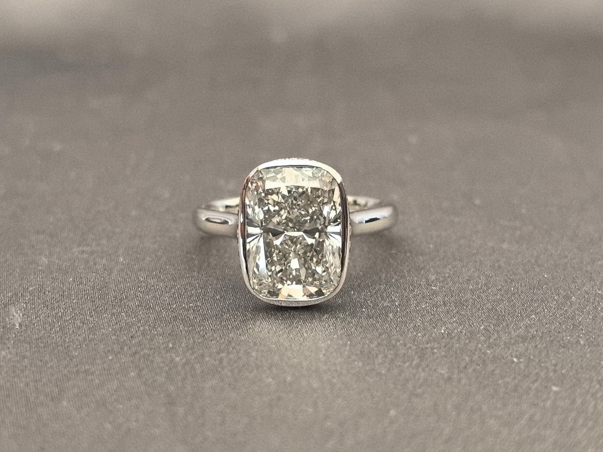 Long Cushion Cut Diamond Ring with a Pink Surprise