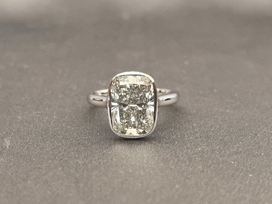 Long Cushion Cut Diamond Ring with a Pink Surprise