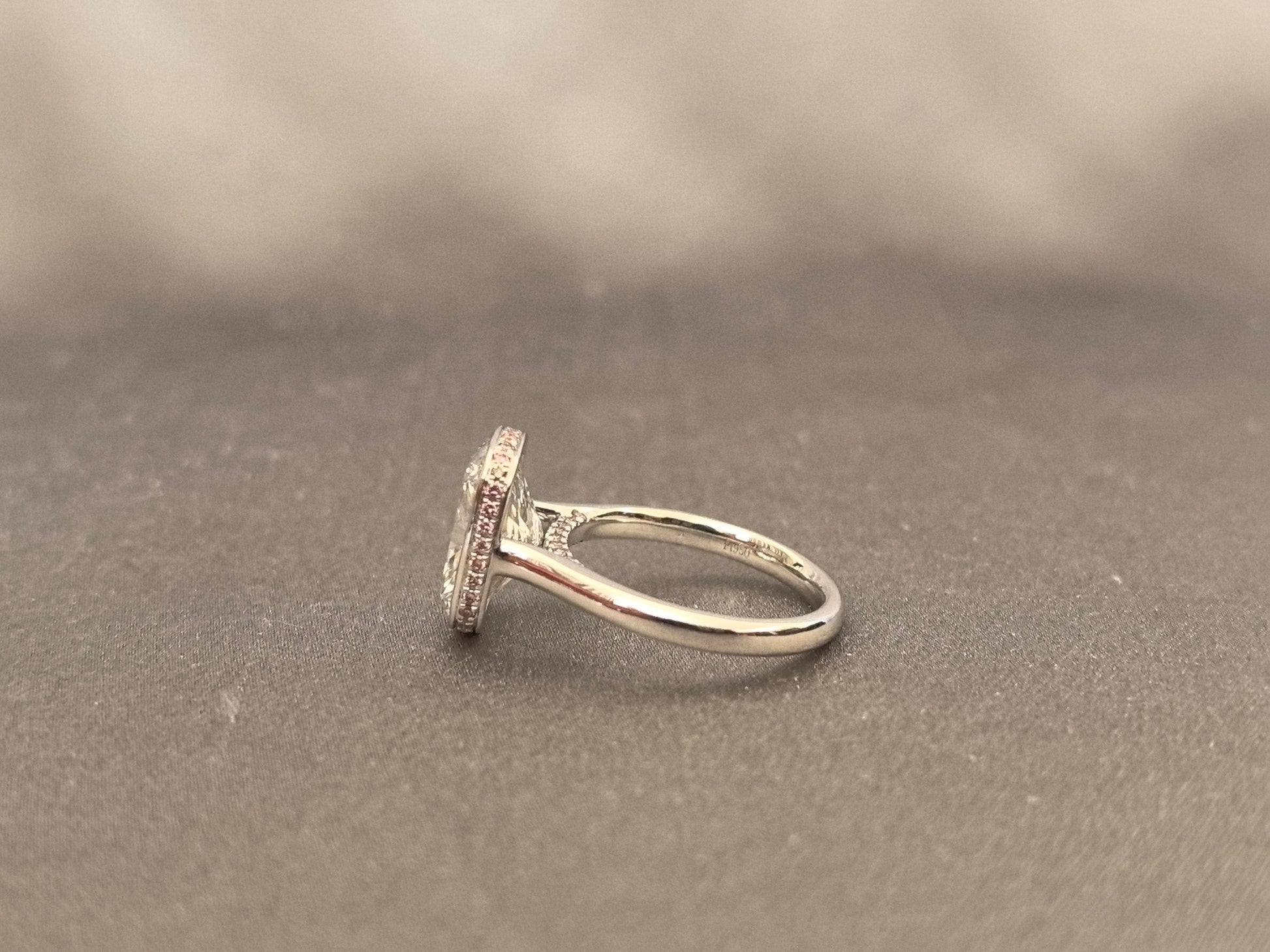 Long Cushion Cut Diamond Ring with a Pink Surprise