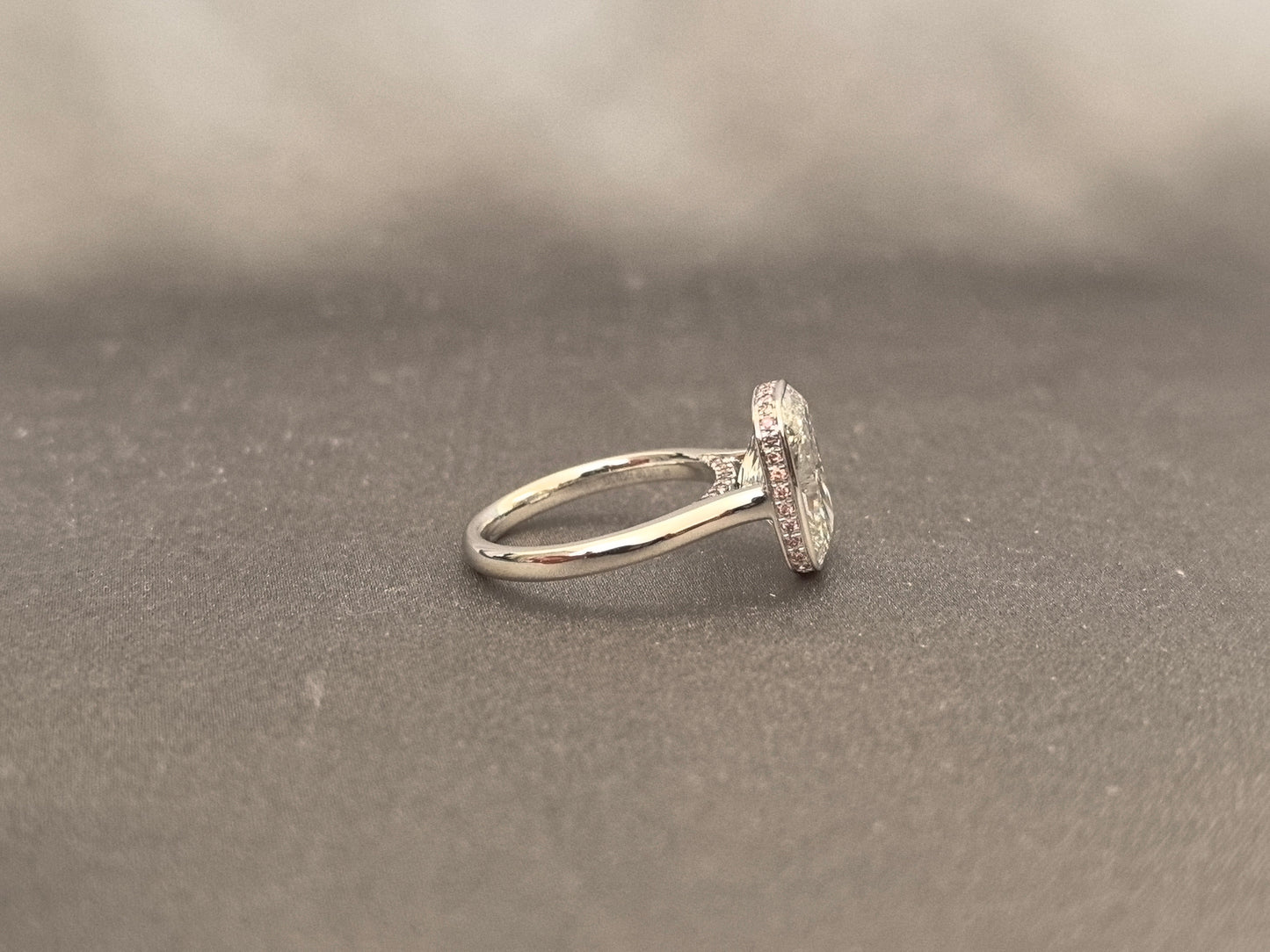 Long Cushion Cut Diamond Ring with a Pink Surprise