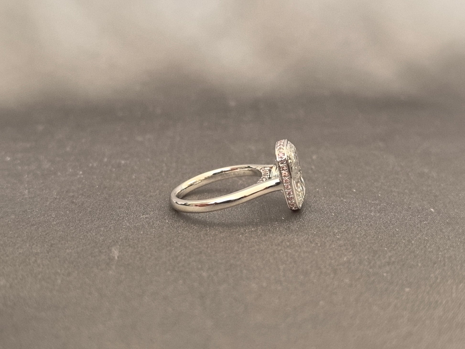 Long Cushion Cut Diamond Ring with a Pink Surprise