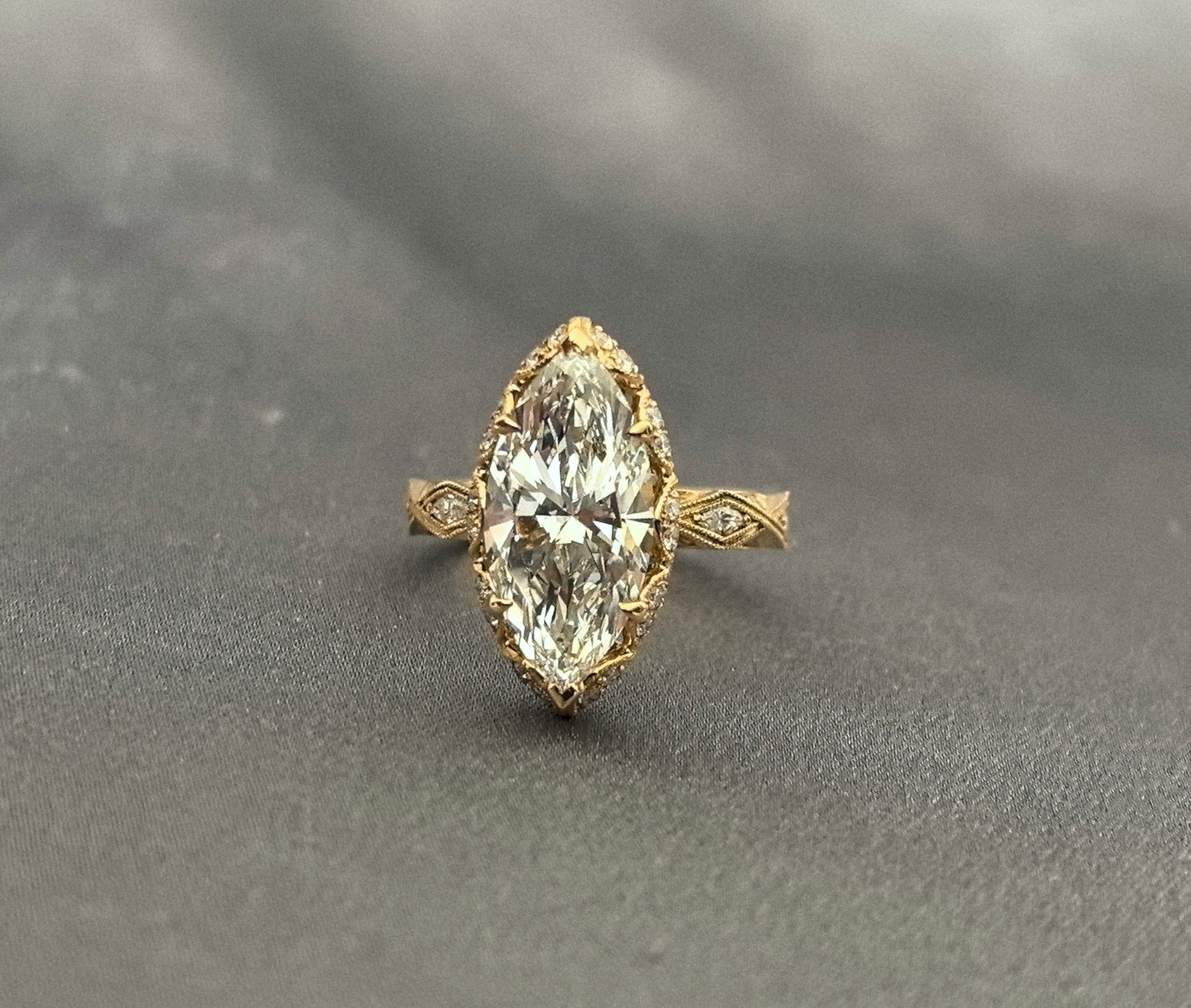 3-carat marquise-cut diamond ring - vintage carved design with scroll and lattice engraving - tulip-shaped setting