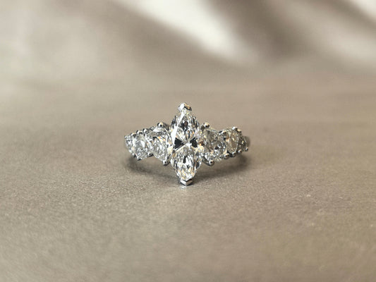Marquise-shaped lab diamond ring - Upside-down teardrop design on both sides - Pear-shaped side stones