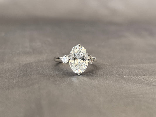 Oval Lab Diamond Three-Stone Ring - Round Side Diamonds - Four-Claw Prong Setting