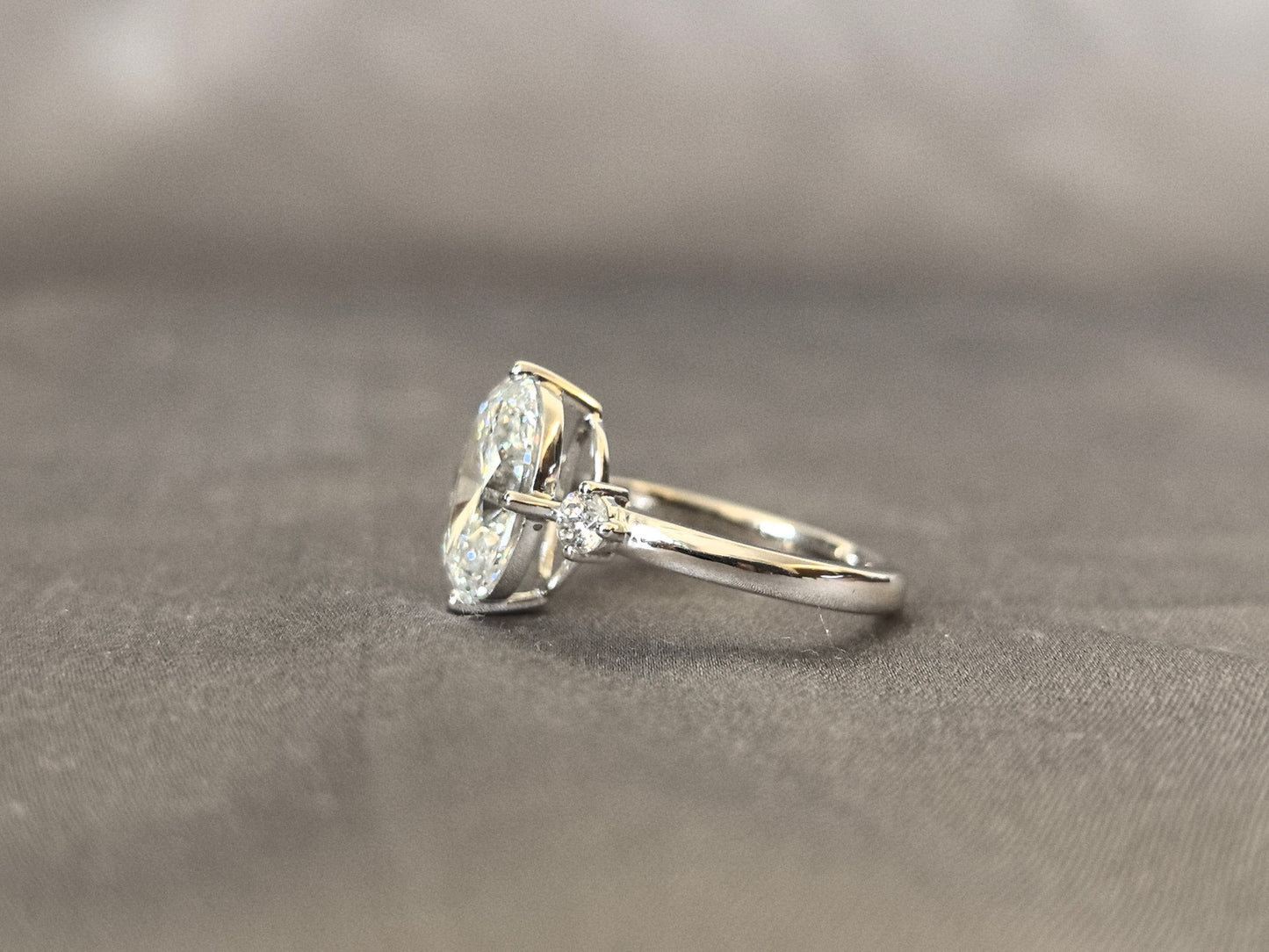 Oval Lab Diamond Three-Stone Ring - Round Side Diamonds - Four-Claw Prong Setting