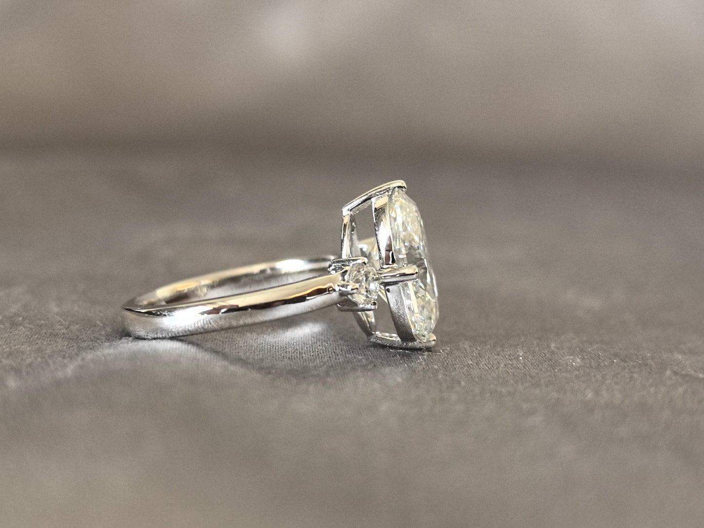 Oval Lab Diamond Three-Stone Ring - Round Side Diamonds - Four-Claw Prong Setting