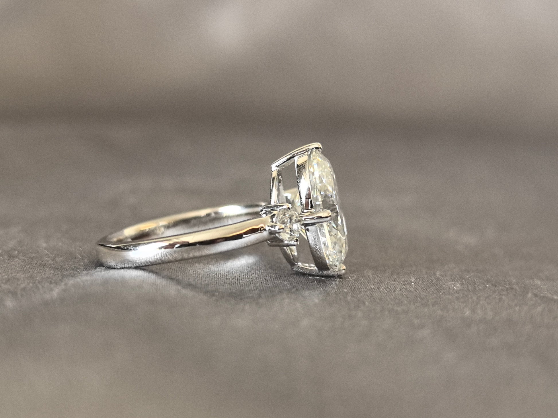 Oval Lab Diamond Three-Stone Ring - Round Side Diamonds - Four-Claw Prong Setting