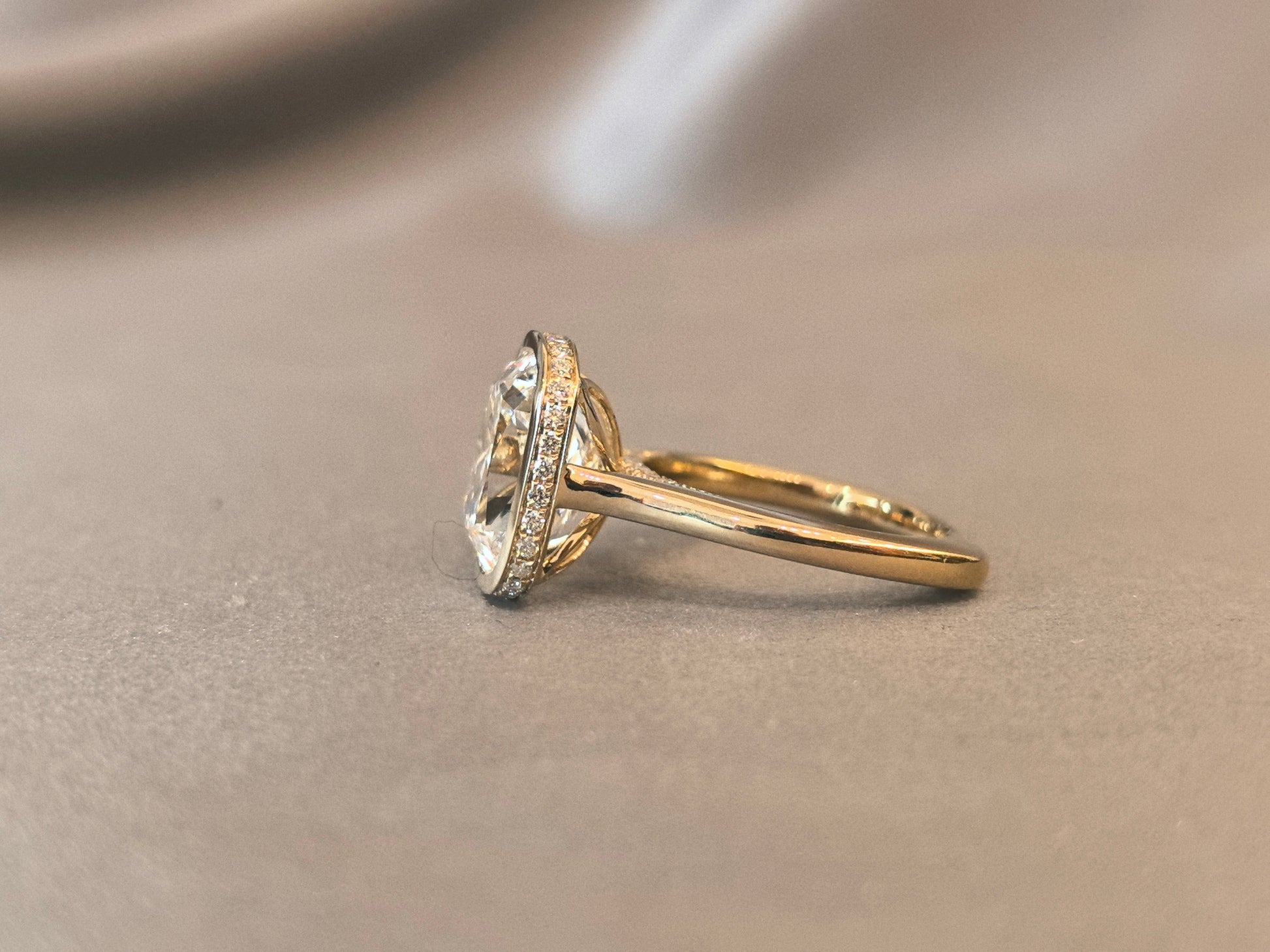 7-carat old mine cut elongated cushion bezel setting In 14K yellow gold