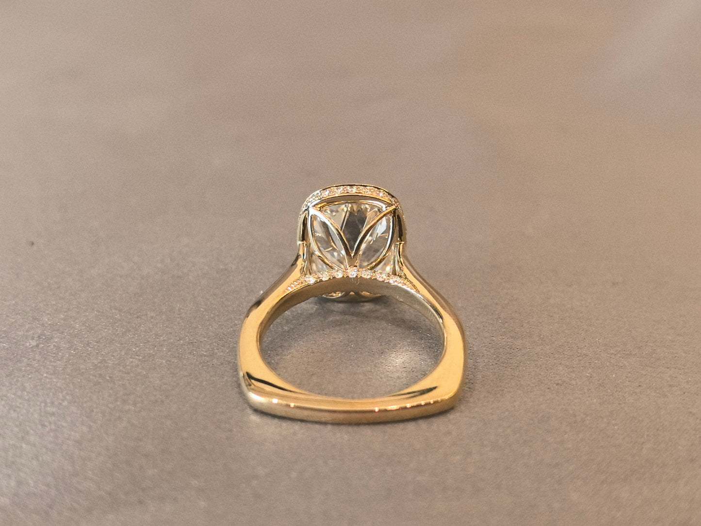 7-carat old mine cut elongated cushion bezel setting In 14K yellow gold