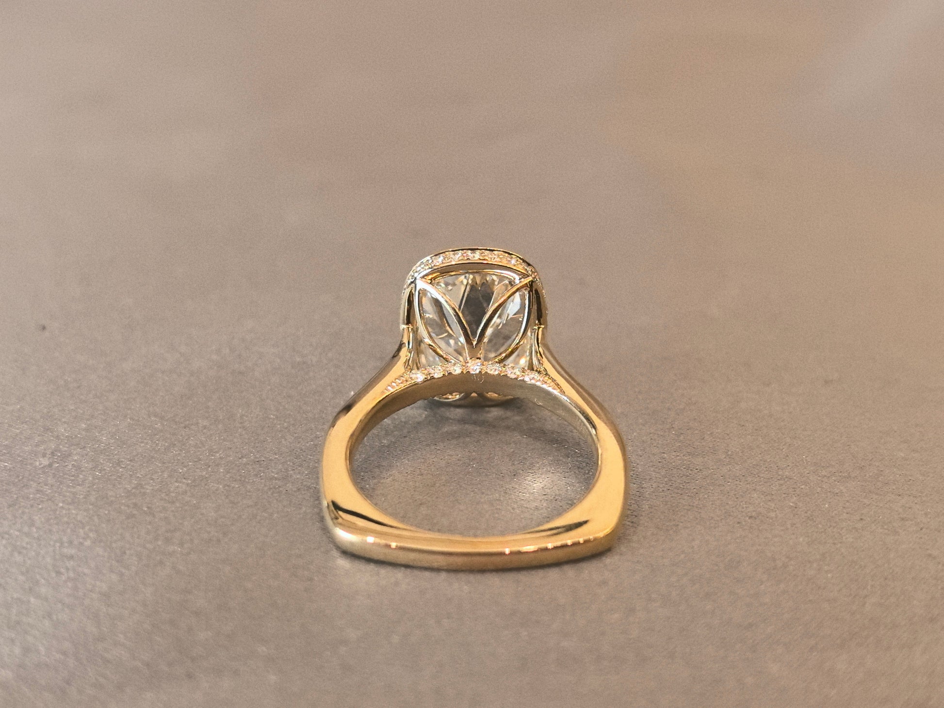 7-carat old mine cut elongated cushion bezel setting In 14K yellow gold