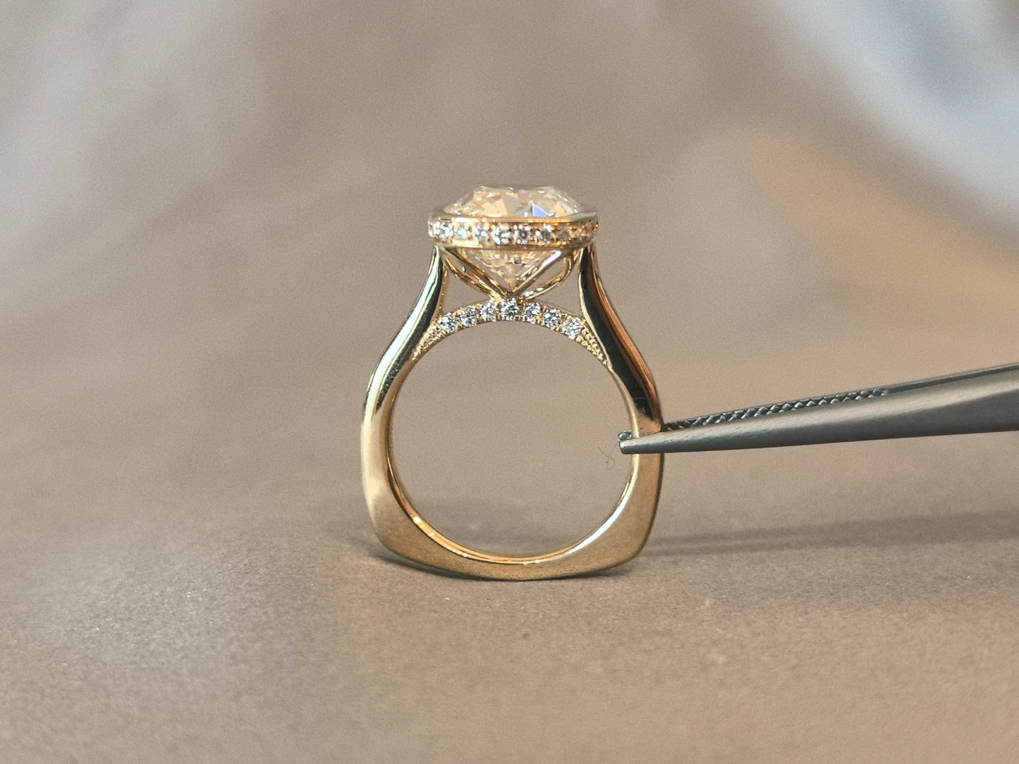 7-carat old mine cut elongated cushion bezel setting In 14K yellow gold
