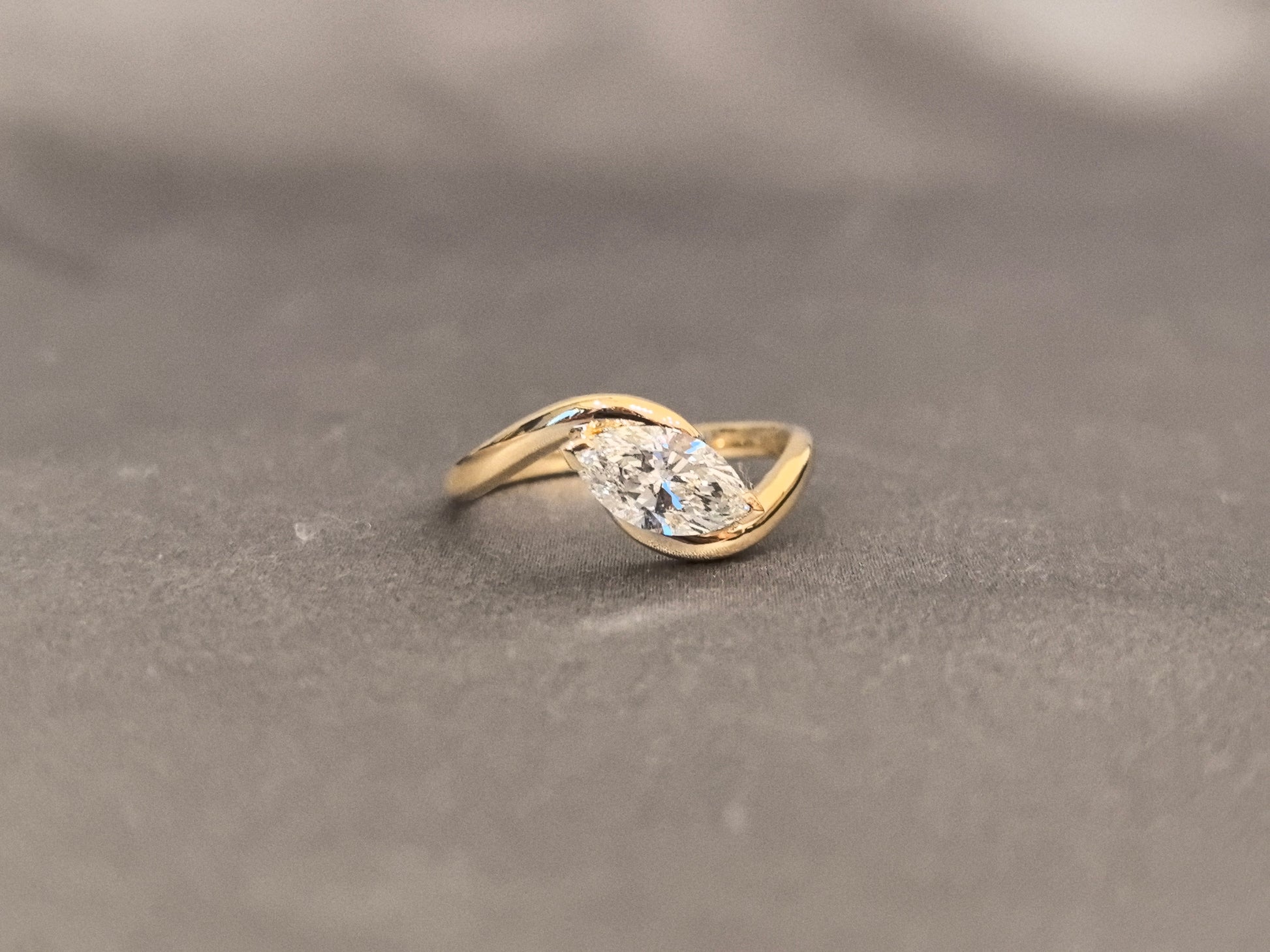 Marquise Cut Bezel Solitaire Ring - Twisted Bypass Band - Yellow Gold Bezel Setting