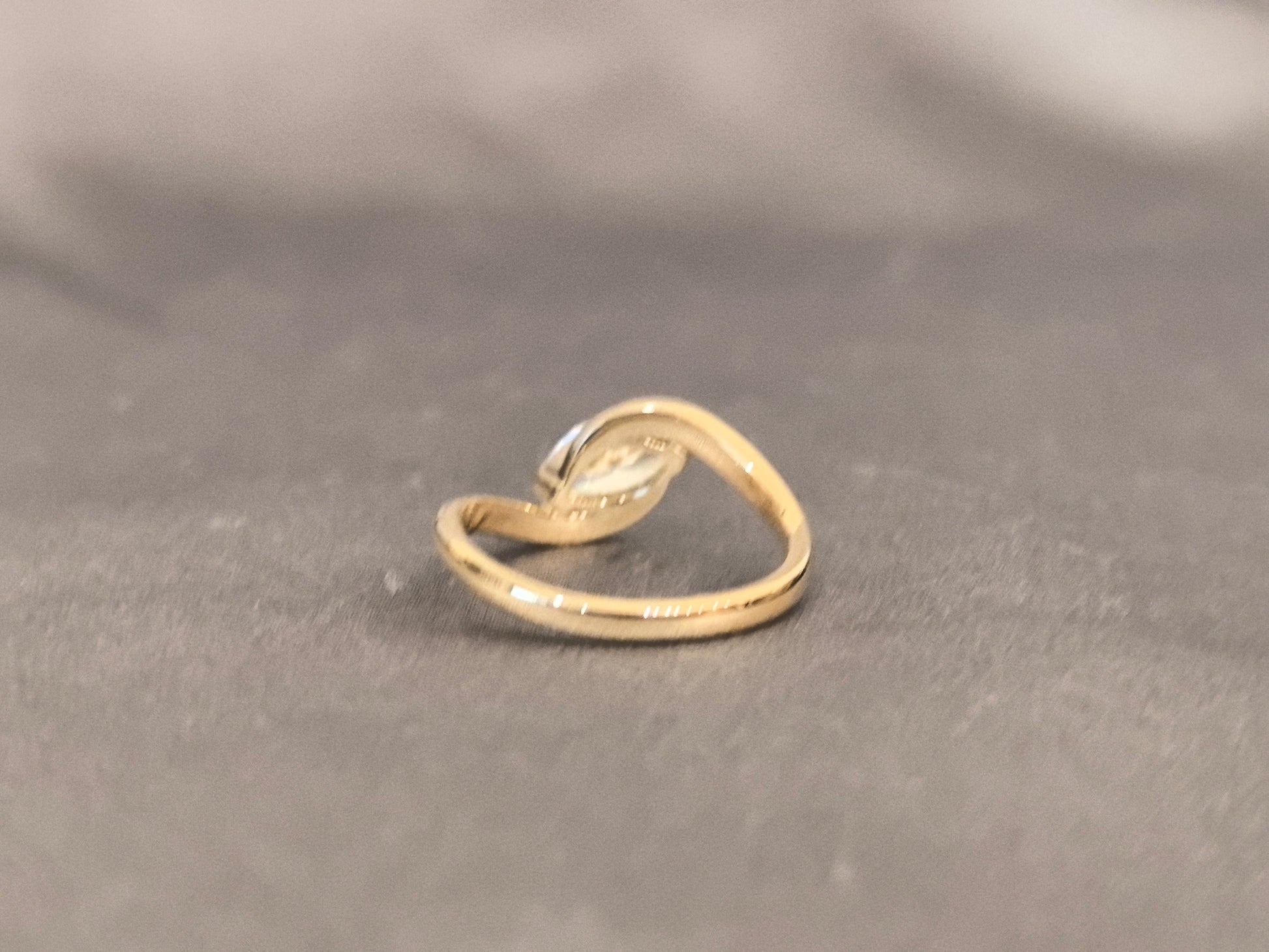 Marquise Cut Bezel Solitaire Ring - Twisted Bypass Band - Yellow Gold Bezel Setting