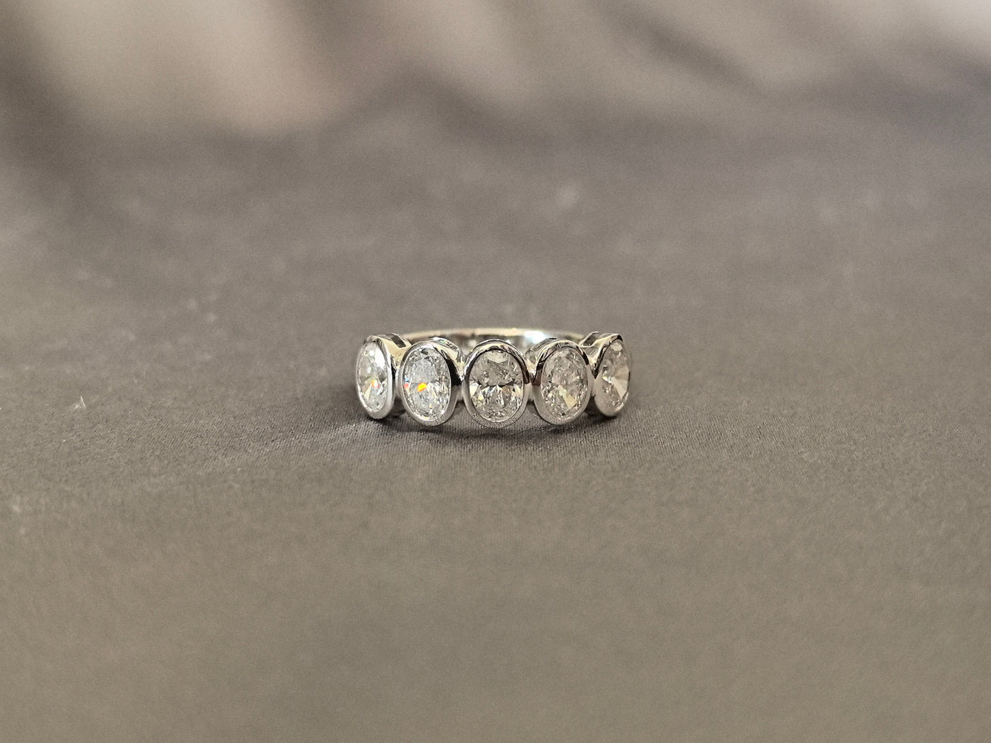 Oval-cut lab diamond half eternity ring - Bezel-set - Five-stone ring