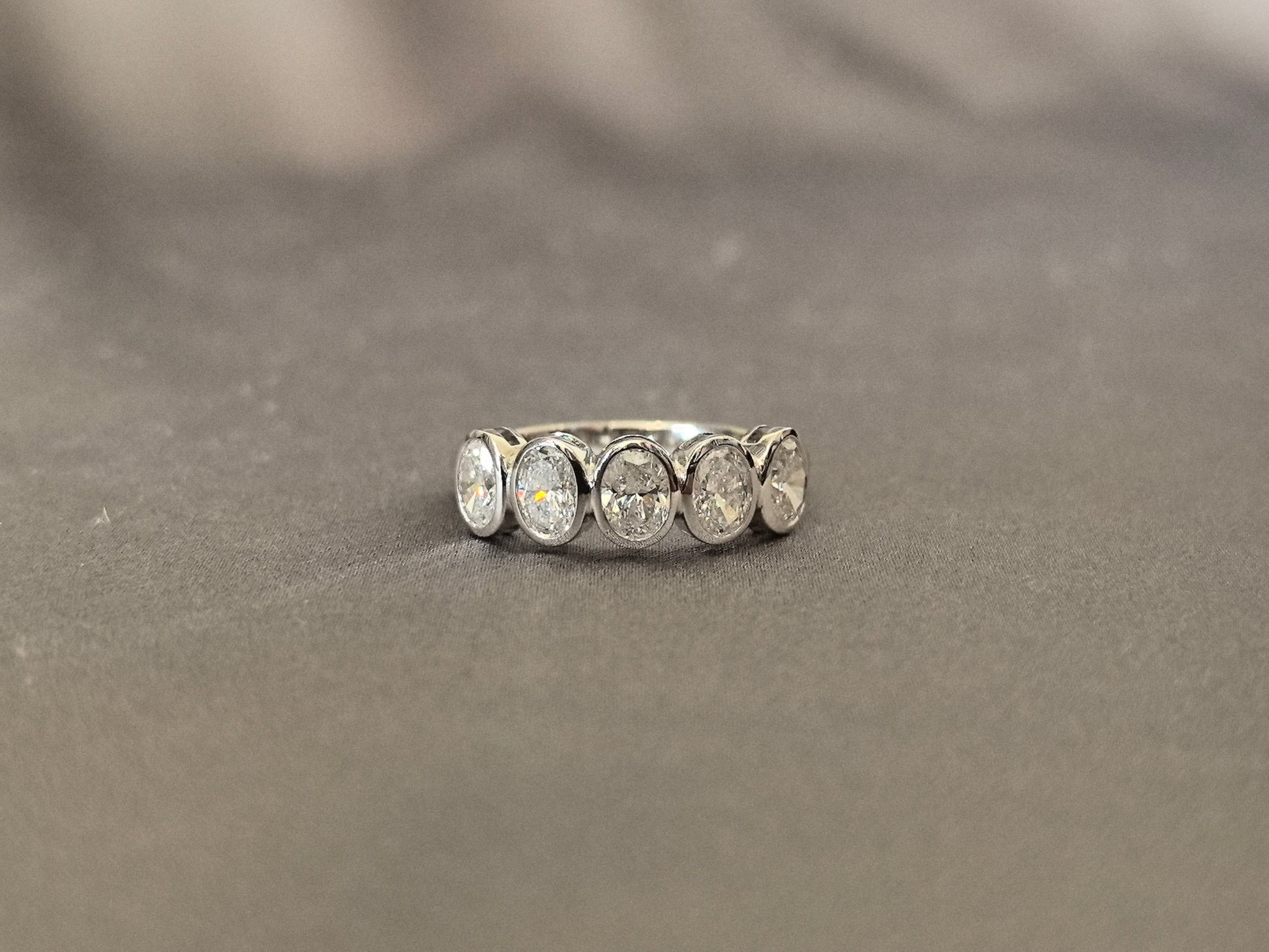 Oval-cut lab diamond half eternity ring - Bezel-set - Five-stone ring