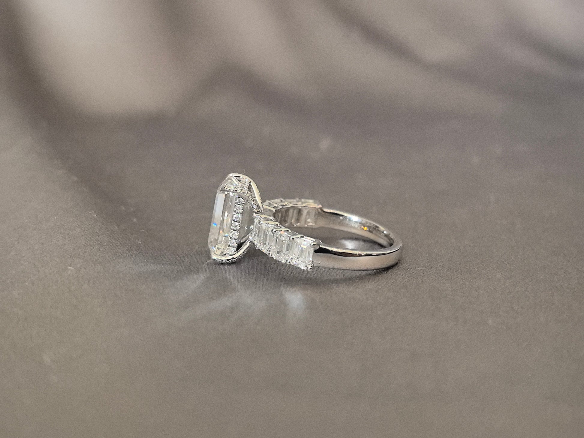 Emerald-cut lab diamond engagement ring - Open gallery design for maximum light flow - Baguette and round diamond accent