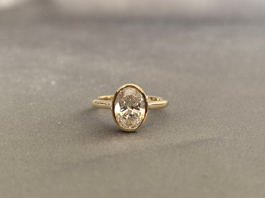 Oval-cut lab diamond solitaire ring - Bezel-set - Low-profile oval diamond