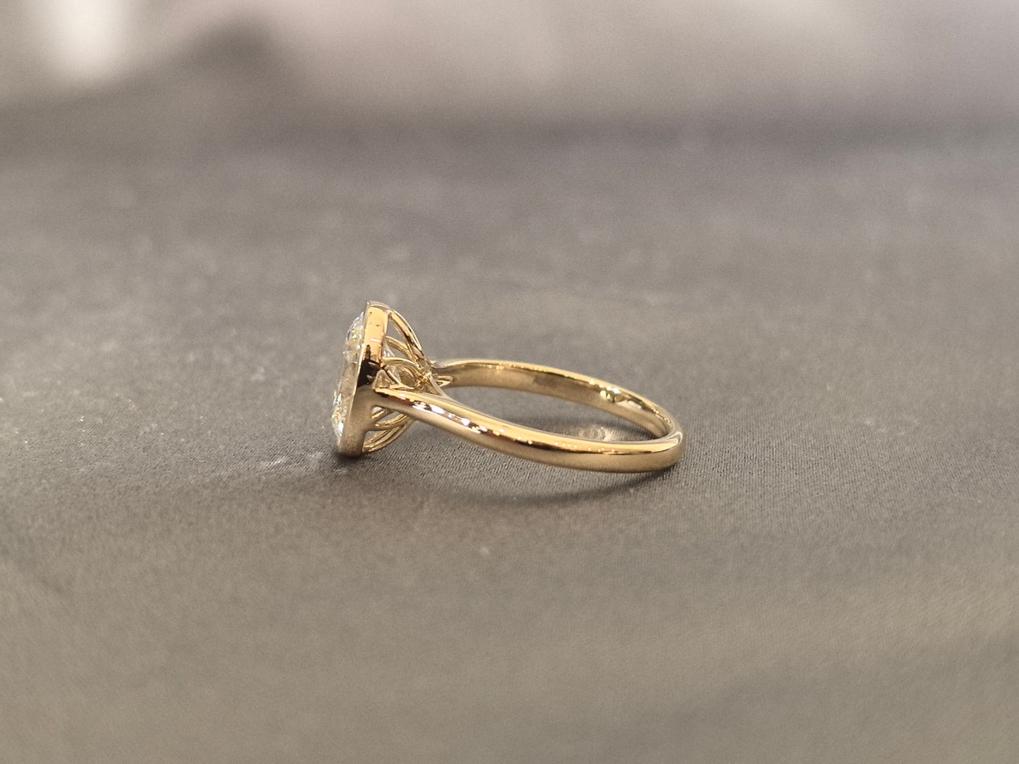 Oval-cut lab diamond solitaire ring - Bezel-set - Low-profile oval diamond