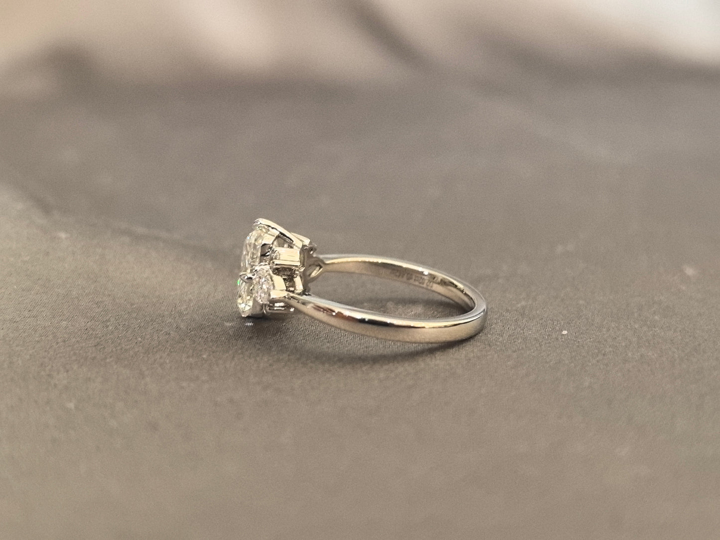 Three-stone emerald-cut lab diamond engagement ring - Pear-shaped sidestone - 4-Prong Set