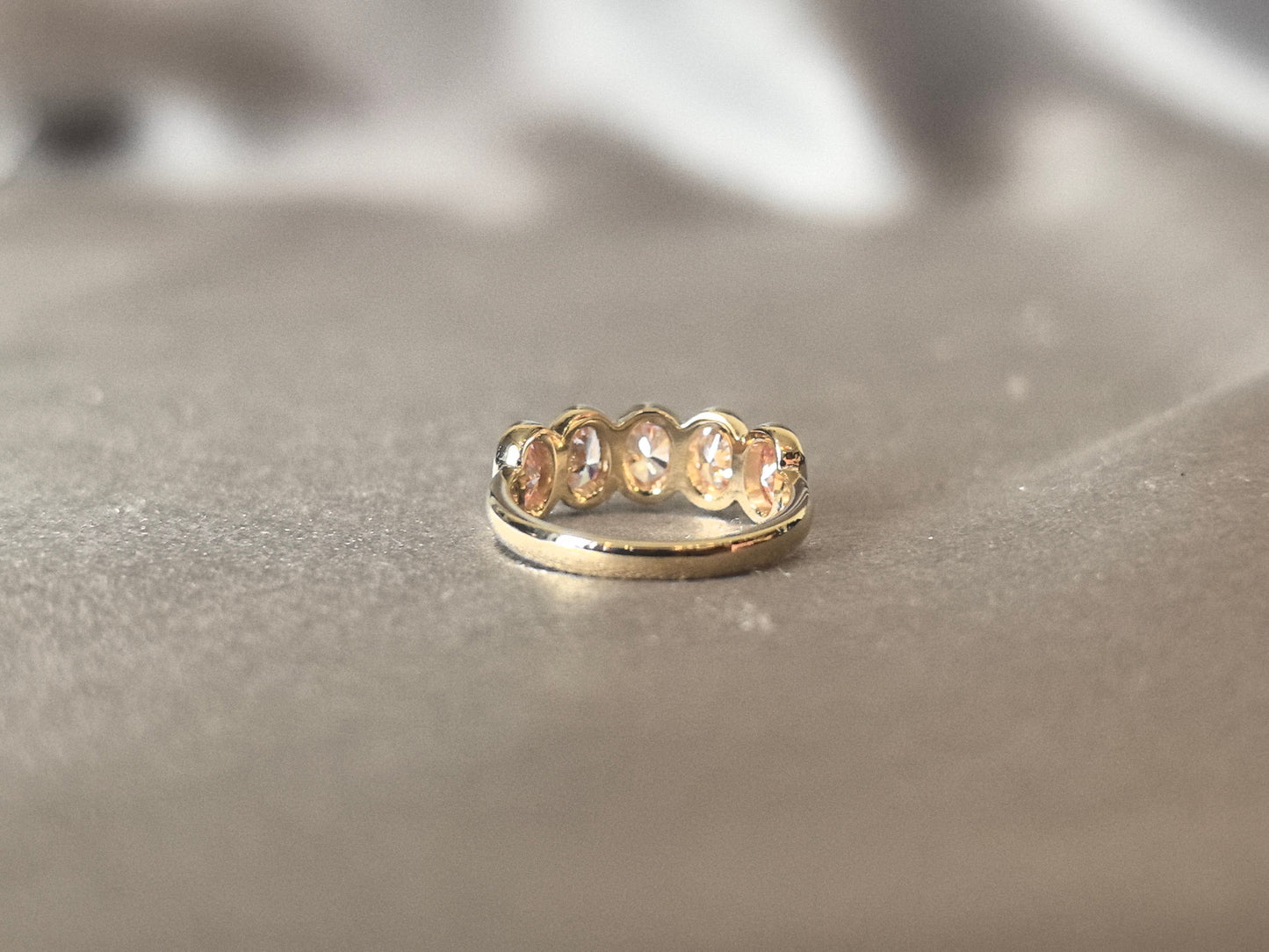 Oval-cut pink lab diamond half eternity ring - Bezel-set champagne diamond wedding band - Scratch-resistant setting