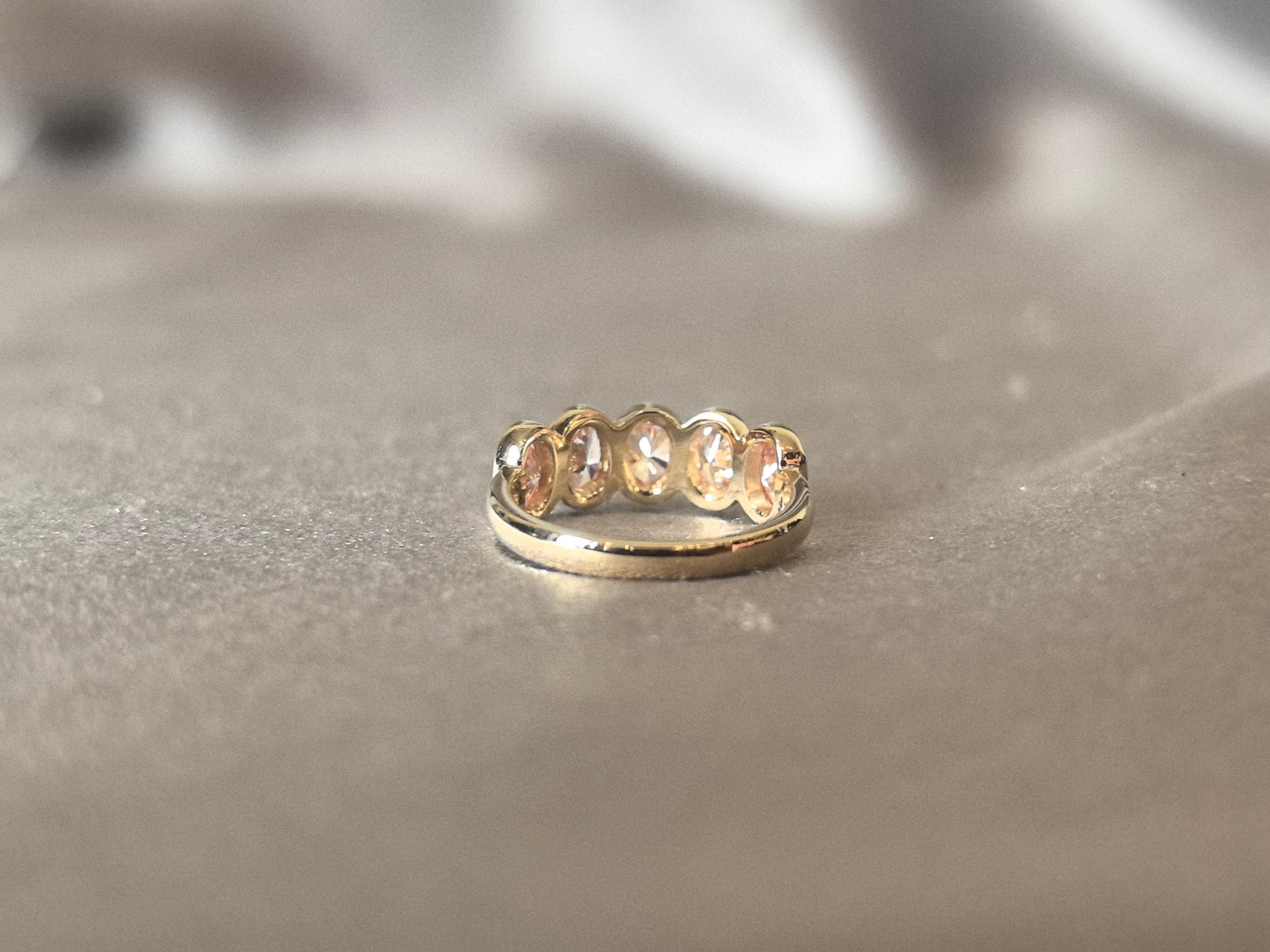 Oval-cut pink lab diamond half eternity ring - Bezel-set champagne diamond wedding band - Scratch-resistant setting